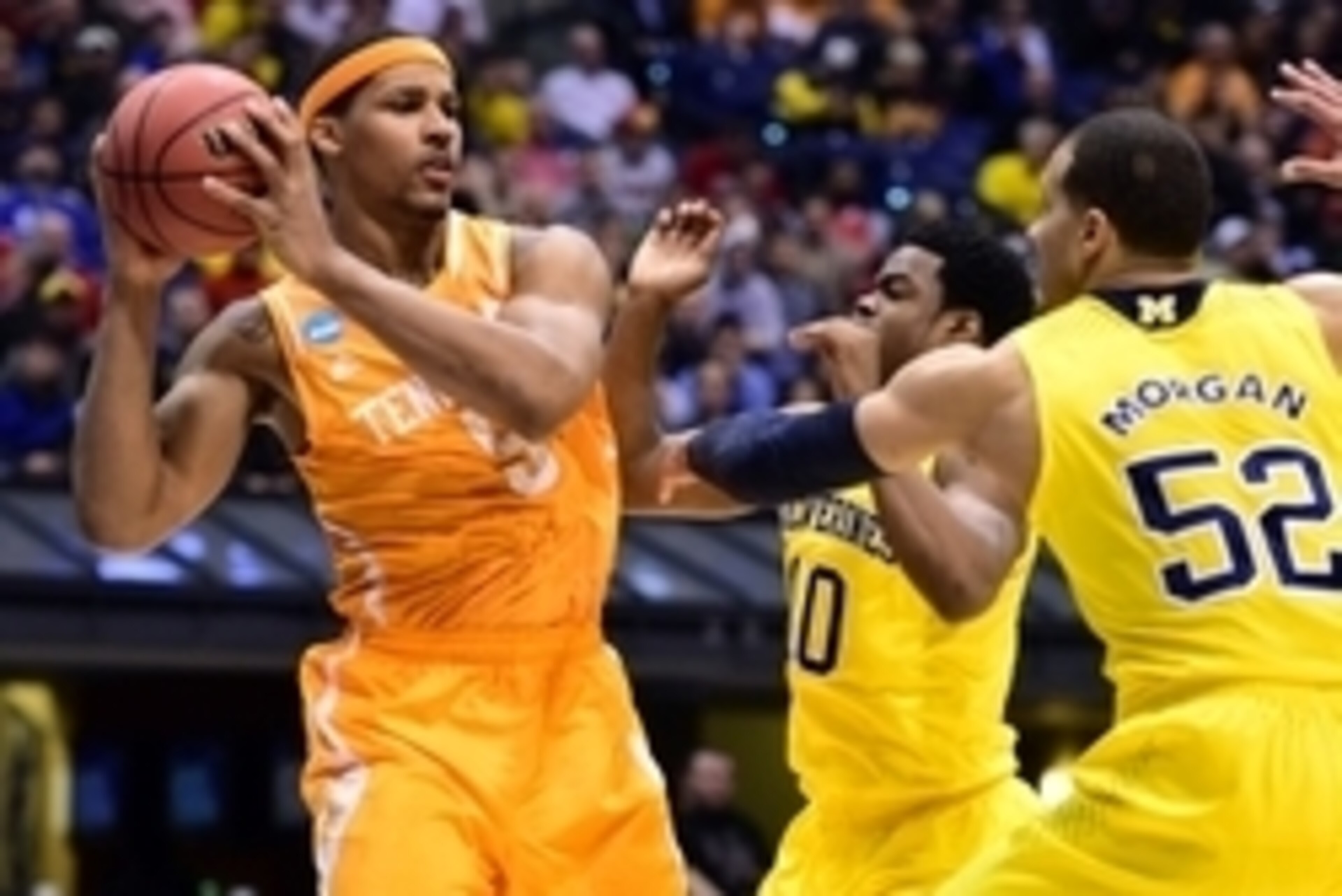 Mar 28, 2014; Indianapolis, IN, USA; Tennessee Volunteers forward Jarnell Stokes (5) looks to pass the ball away from Michigan Wolverines forward Jordan Morgan (52) and guard Derrick Walton Jr. (10) in the first half in the semifinals of the midwest regi Mar 28, 2014; Indianapolis, IN, USA; Tennessee Volunteers forward Jarnell Stokes (5) looks to pass the ball away from Michigan Wolverines forward Jordan Morgan (52) and guard Derrick Walton Jr. (10) in the first half in the semifinals of the midwest regi