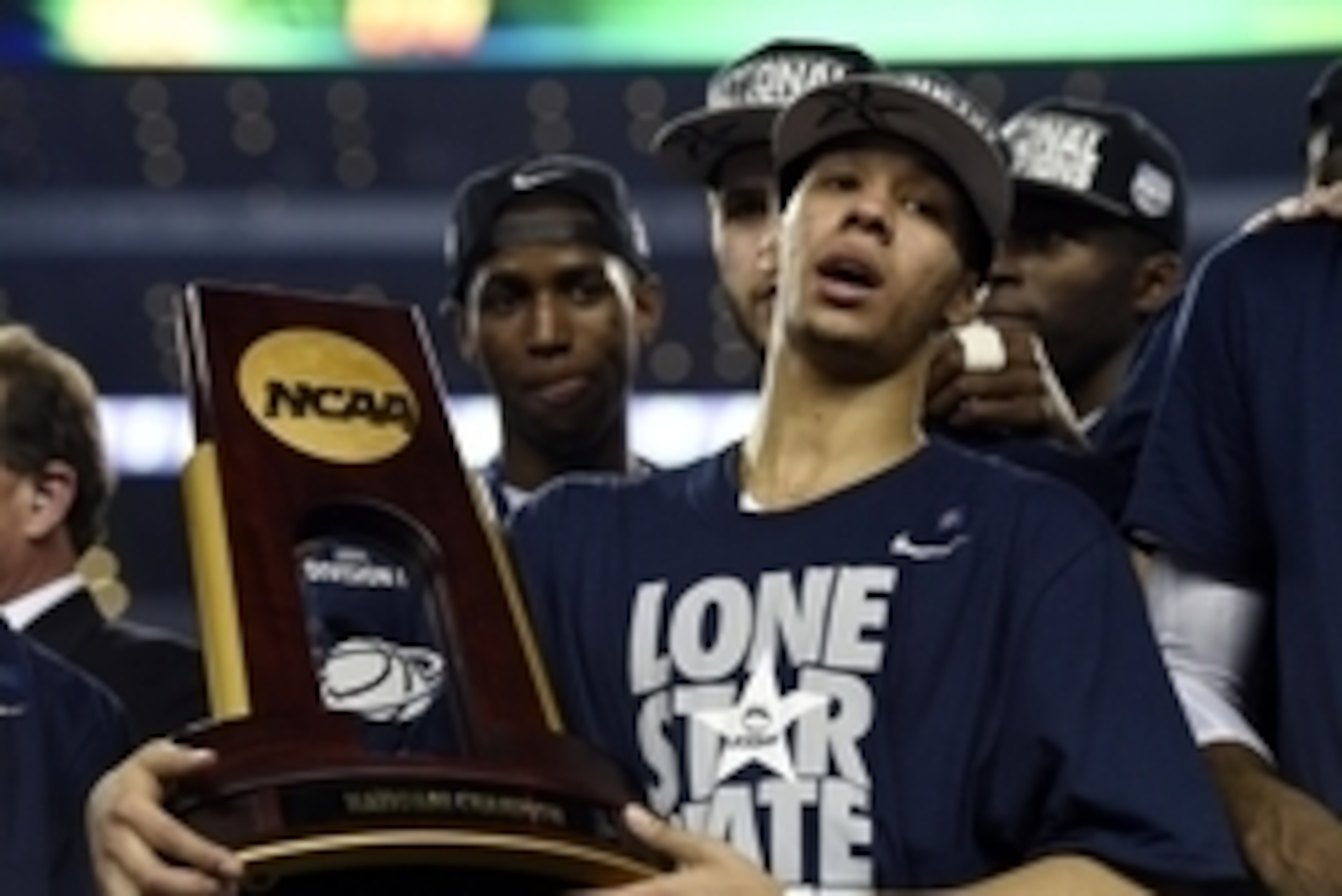 Apr 7, 2014; Arlington, TX, USA; Connecticut Huskies guard Shabazz Napier (13) holds the national championship trophy after defeating the Kentucky Wildcats in the championship game of the Final Four in the 2014 NCAA Mens Division I Championship tournament Apr 7, 2014; Arlington, TX, USA; Connecticut Huskies guard Shabazz Napier (13) holds the national championship trophy after defeating the Kentucky Wildcats in the championship game of the Final Four in the 2014 NCAA Mens Division I Championship tournament
