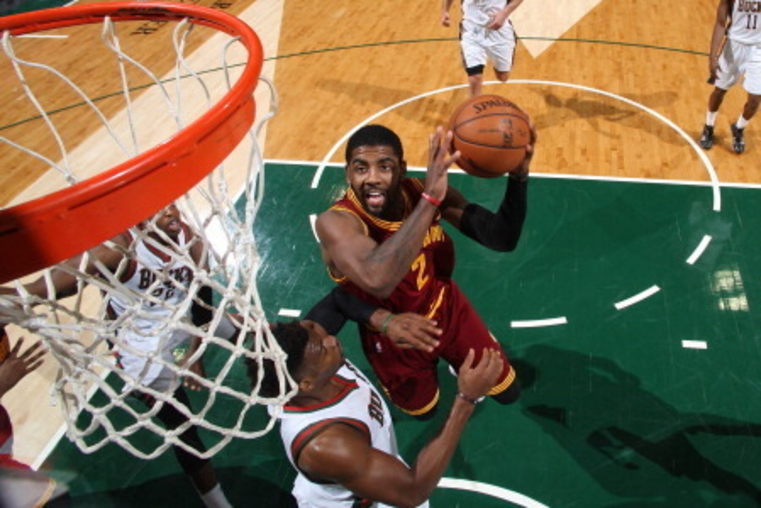 MILWAUKEE, WI - APRIL 11: Kyrie Irving #2 of the Cleveland Cavaliers shoots the ball against Jeff Adrien #12 of the Milwaukee Bucks on April 11, 2014 at the BMO Harris Bradley Center in Milwaukee, Wisconsin. NOTE TO USER:  User expressly acknowledges and 