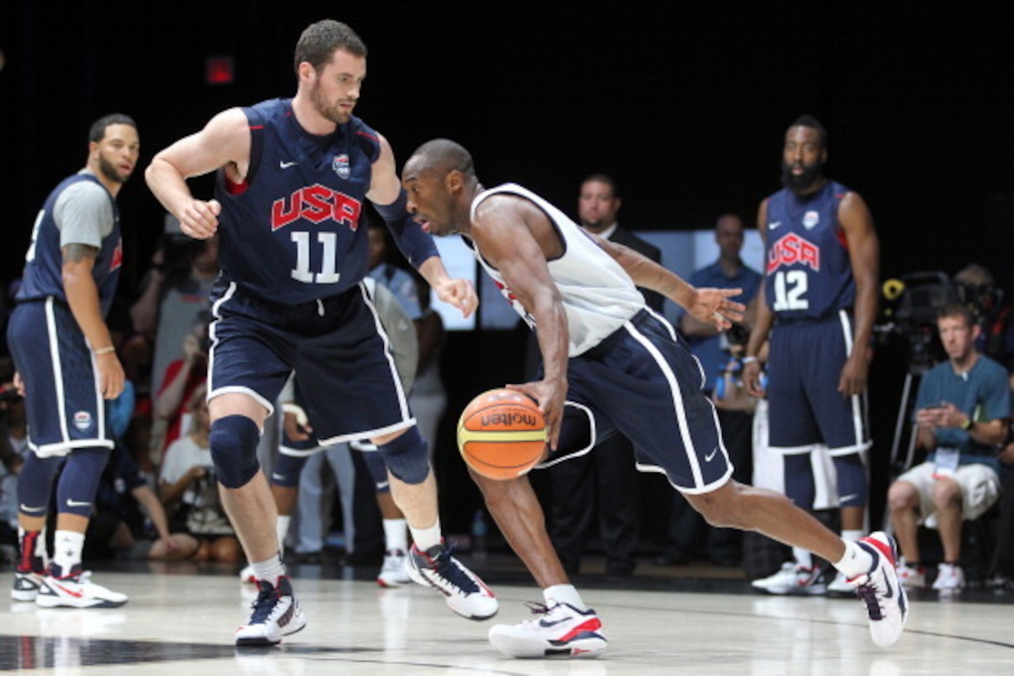 WASHINGTON, DC - JULY 14: Kobe Bryant #10 of the USA Men's Senior National Team drives against Kevin Love #11 at the DC Armory during USA Men's Senior National Team training camp at on July 14, 2012 in Washington, DC. NOTE TO USER: User expressly acknowle