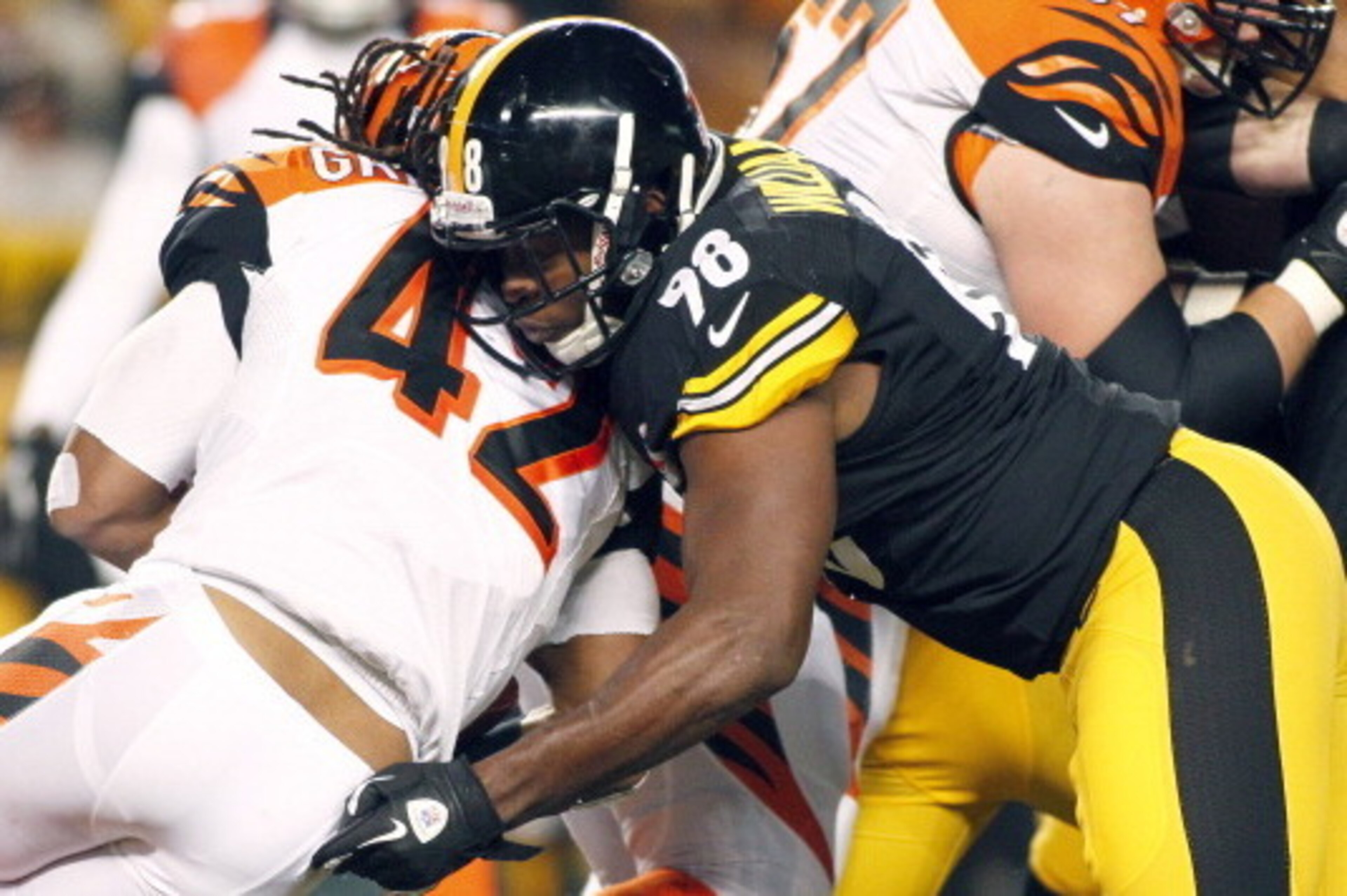 PITTSBURGH, PA - DECEMBER 15: Vince Williams #98 of the Pittsburgh Steelers tackles BenJarvus Green-Ellis #42 of the Cincinnati Bengals during the game on December 15, 2013 at Heinz Field in Pittsburgh, Pennsylvania. (Photo by Justin K. Aller/Getty Imag PITTSBURGH, PA - DECEMBER 15: Vince Williams #98 of the Pittsburgh Steelers tackles BenJarvus Green-Ellis #42 of the Cincinnati Bengals during the game on December 15, 2013 at Heinz Field in Pittsburgh, Pennsylvania. (Photo by Justin K. Aller/Getty Imag