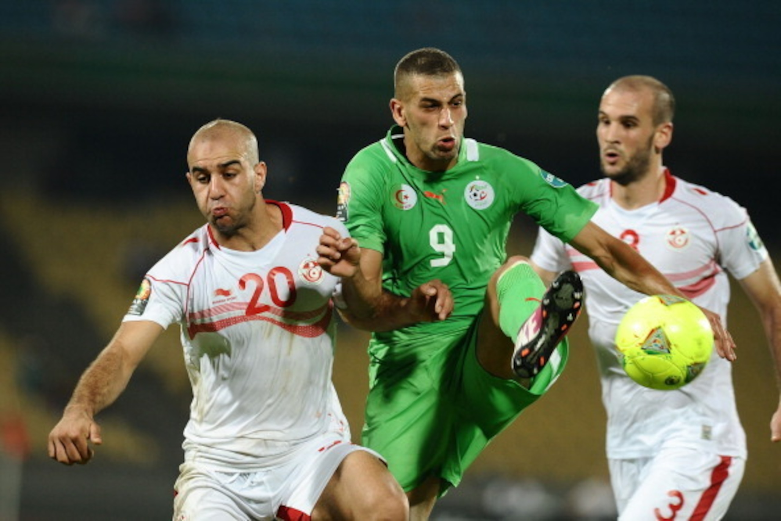 RUSTENBURG, SOUTH AFRICA - JANUARY 22: Aymen Abdennour of Tunisia and Islam Slimani of Algeria during the 2013 Orange African Cup of Nations match between Tunisia and Algeria from Royal Bafokeng Stadium on JANUARY 22: 2012 in Rustenburg, South Africa.  (P