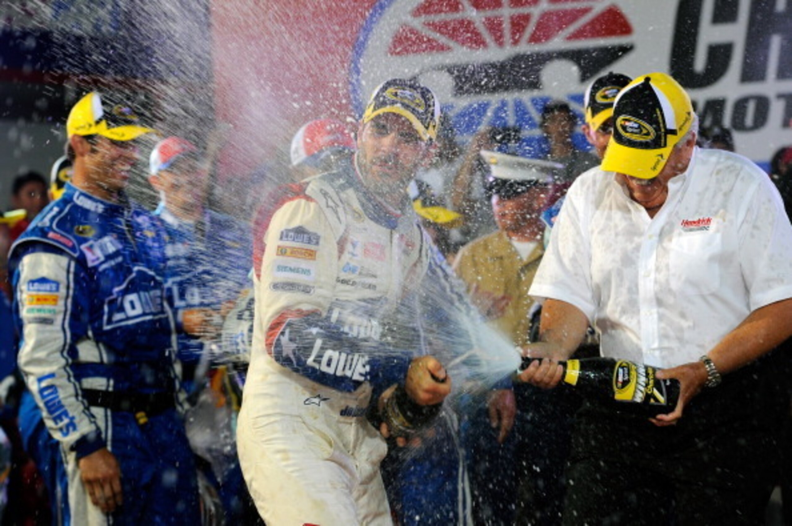 CHARLOTTE, NC - MAY 25:  Jimmie Johnson, driver of the #48 Lowe's Patriotic Chevrolet, celebrates in victory lane after winning the NASCAR Sprint Cup Series Coca-Cola 600 at Charlotte Motor Speedway on May 25, 2014 in Charlotte, North Carolina.  (Photo by