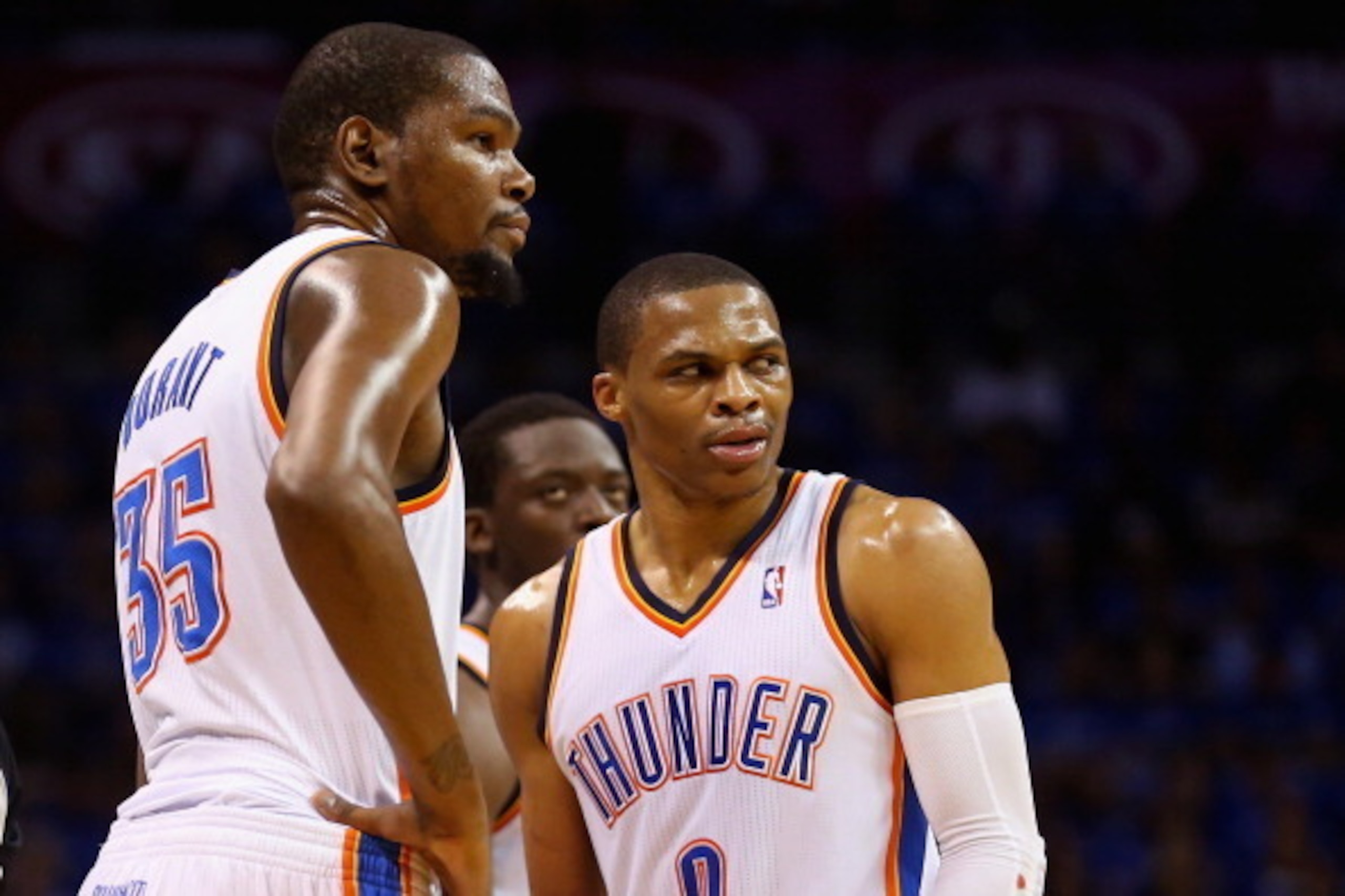 OKLAHOMA CITY, OK - MAY 25: Kevin Durant #35 and Russell Westbrook #0 of the Oklahoma City Thunder look on after a call in the second quarter against the San Antonio Spurs during Game Three of the Western Conference Finals of the 2014 NBA Playoffs at Ches
