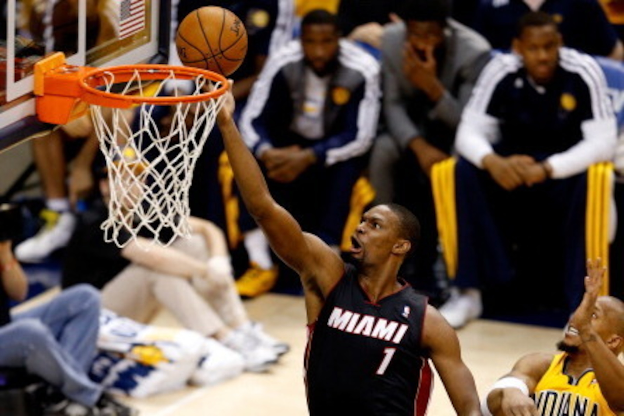 INDIANAPOLIS, IN - MAY 20:  Chris Bosh #1 of the Miami Heat goes to the basket as David West #21 of the Indiana Pacers defends during Game Two of the Eastern Conference Finals of the 2014 NBA Playoffs at at Bankers Life Fieldhouse on May 20, 2014 in India