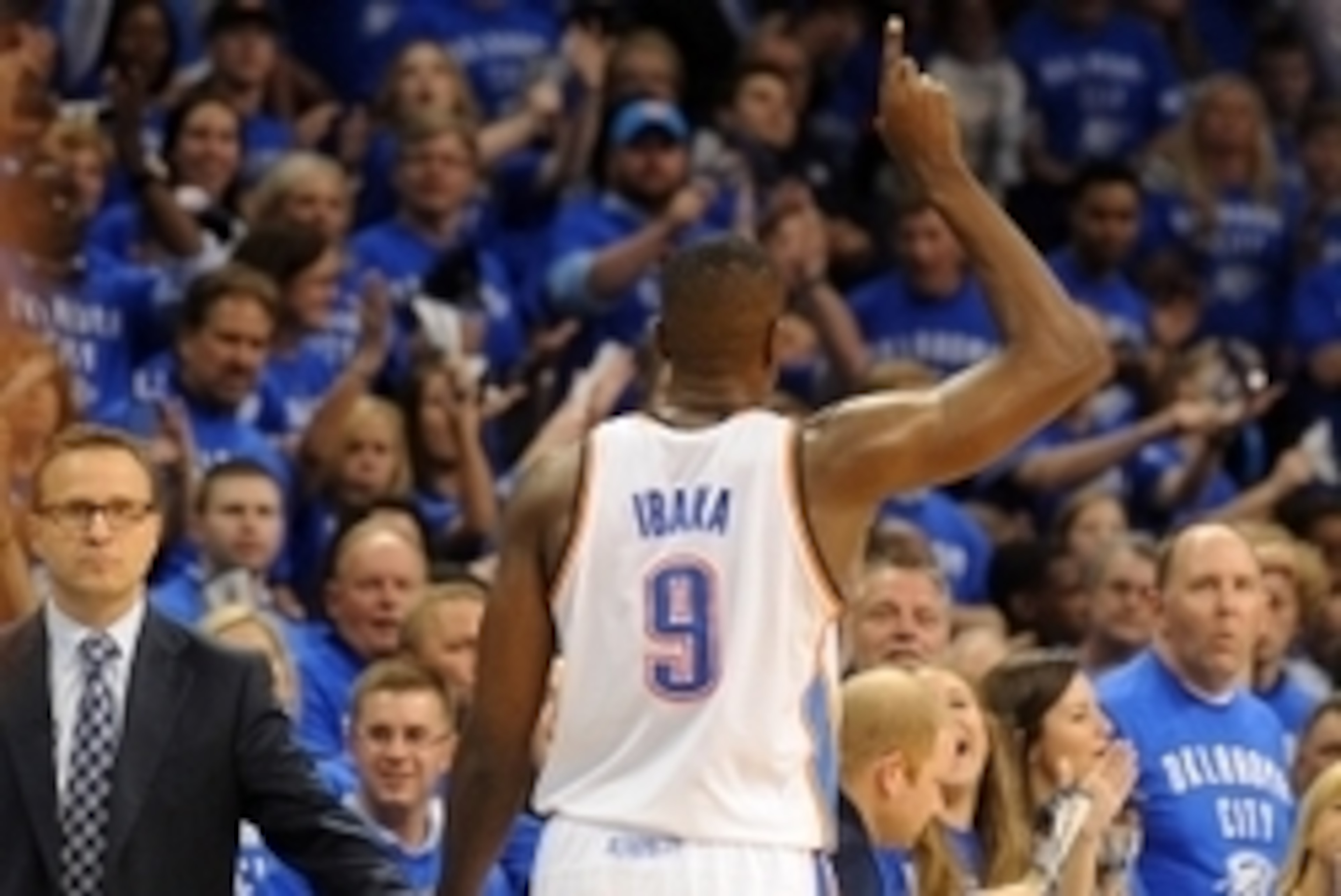 May 25, 2014; Oklahoma City, OK, USA; Oklahoma City Thunder head coach Scott Brooks slaps hands with forward Serge Ibaka (9) as he leaves the court against the San Antonio Spurs during the fourth quarter in game three of the Western Conference Finals of t