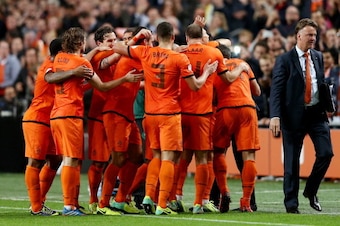 AMSTERDAM, NETHERLANDS - OCTOBER 11:  Holland manager Louis van Gaal celebrates with his team during the FIFA 2014 World Cup Qualifing match between Holland and Hungary at Amsterdam Arena on October 11, 2013 in Amsterdam, Netherlands.  (Photo by Scott Hea