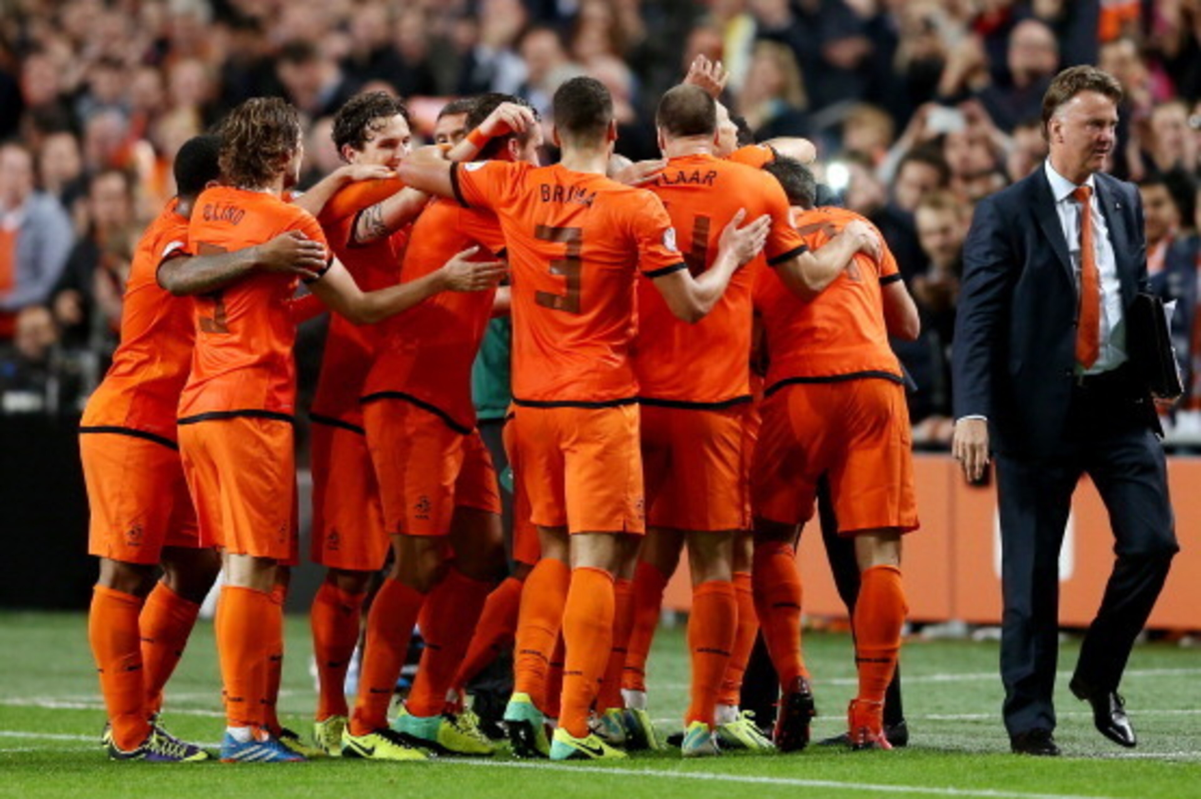 AMSTERDAM, NETHERLANDS - OCTOBER 11:  Holland manager Louis van Gaal celebrates with his team during the FIFA 2014 World Cup Qualifing match between Holland and Hungary at Amsterdam Arena on October 11, 2013 in Amsterdam, Netherlands.  (Photo by Scott Hea