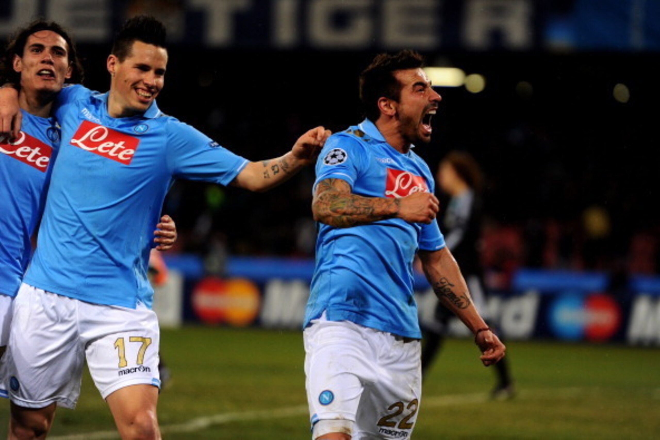 NAPLES, ITALY - FEBRUARY 21:  Ezequiel Lavezzi (R) of Napoli celebrates after scoring his team's third goal during the UEFA Champions League round of 16 first leg match between SSC Napoli and Chelsea FC at Stadio San Paolo on February 21, 2012 in Naples, 