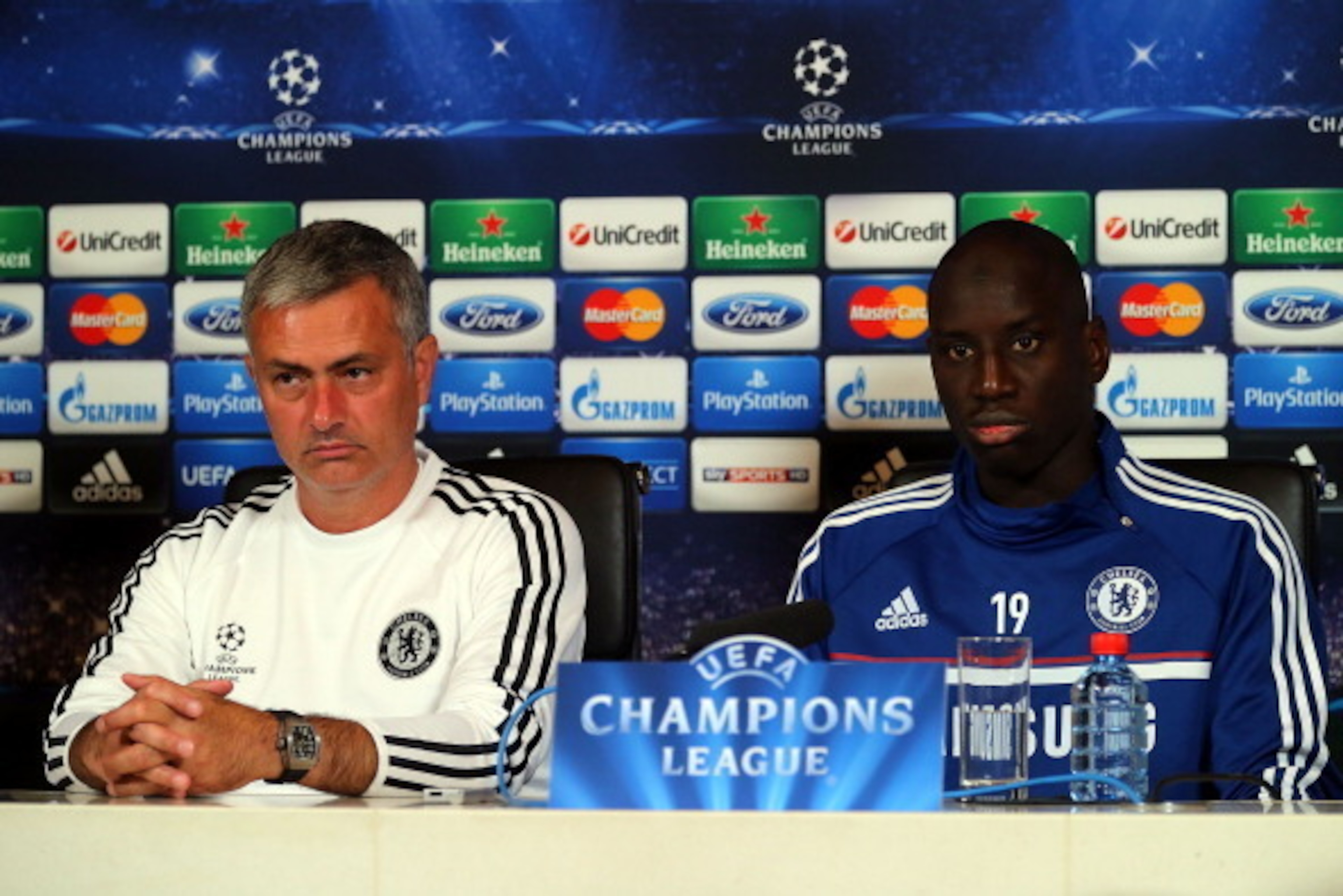 COBHAM, ENGLAND - SEPTEMBER 17:  Jose Mourinho and Demba Ba of Chelsea speak during a press conference on September 17, 2013 in Cobham, England.  (Photo by Clive Rose/Getty Images)