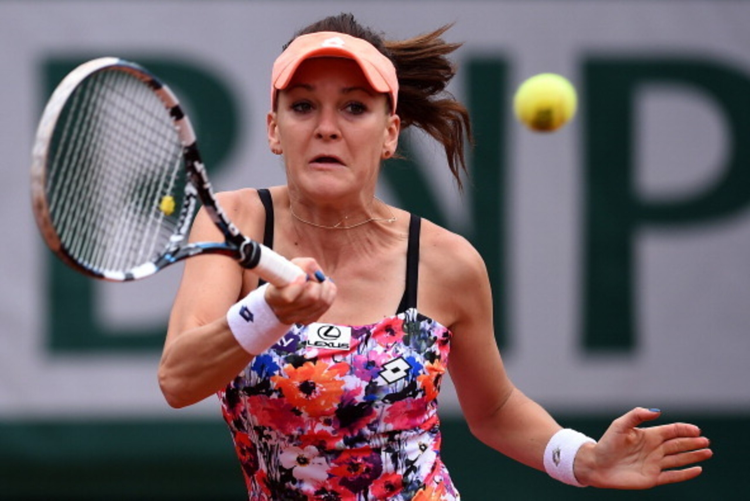 PARIS, FRANCE - MAY 25:  Agnieszka Radwanska of Poland returns a shot during her women's singles match against Shuai Zhang of China on day one of the French Open at Roland Garros on May 25, 2014 in Paris, France.  (Photo by Matthias Hangst/Getty Images)