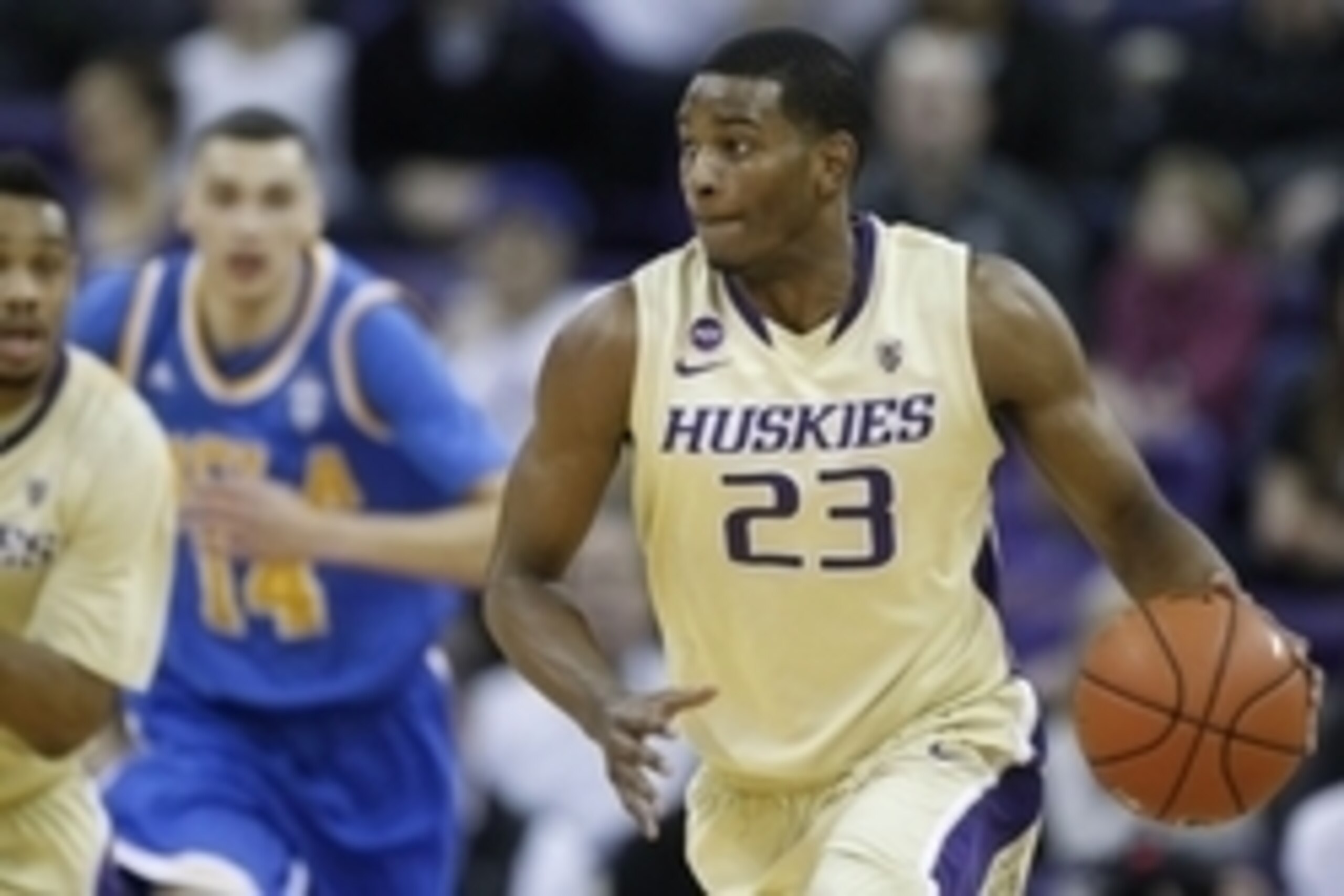 Mar 6, 2014; Seattle, WA, USA; Washington Huskies guard C.J. Wilcox (23) dribbles the ball against the UCLA Bruins during the second half at Alaska Airlines Arena at Hec Edmundson Pavilion. Mandatory Credit: Joe Nicholson-USA TODAY Sports