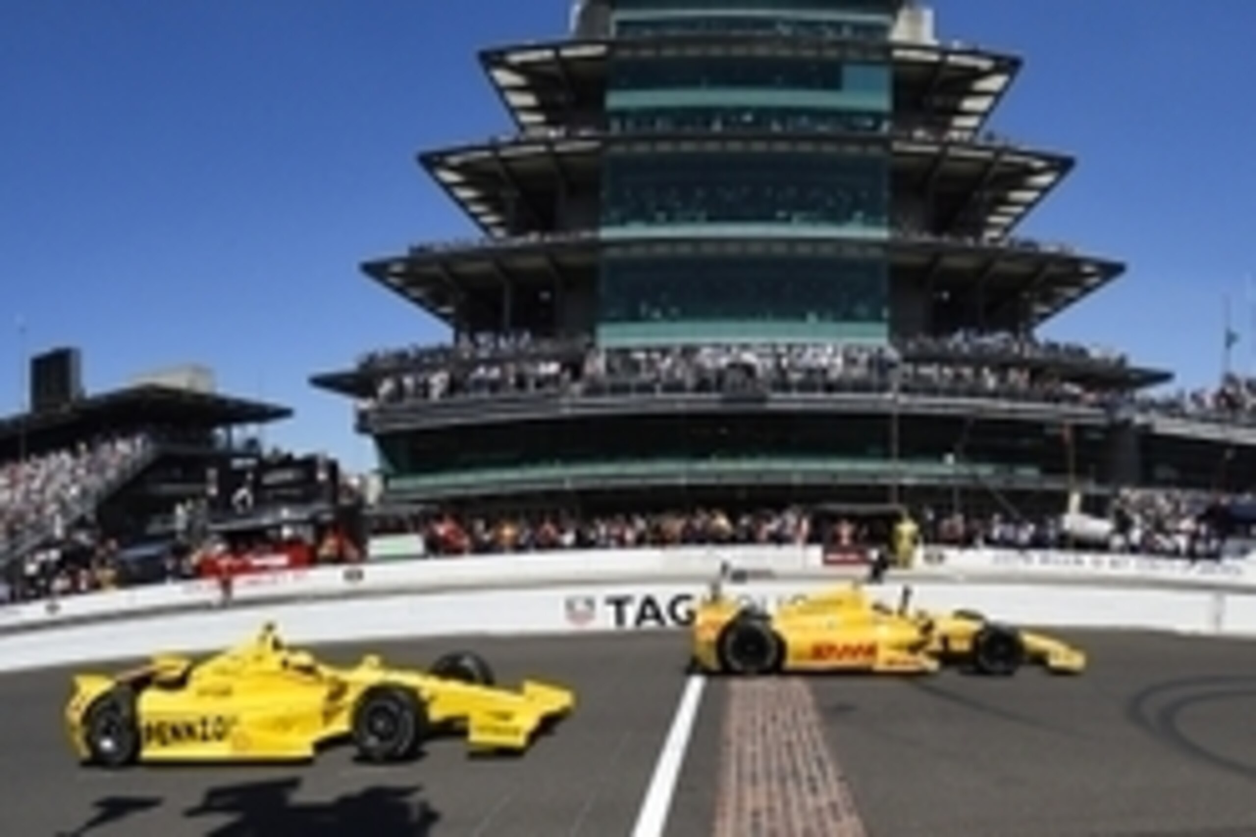 May 25, 2014; Indianapolis, IN, USA; IndyCar Series driver Ryan Hunter-Reay (28) crosses the start/finish line in front of  Helio Castroneves (3) to win the 2014 Indianapolis 500 at Indianapolis Motor Speedway. Mandatory Credit: Mike Dinovo-USA TODAY Spor