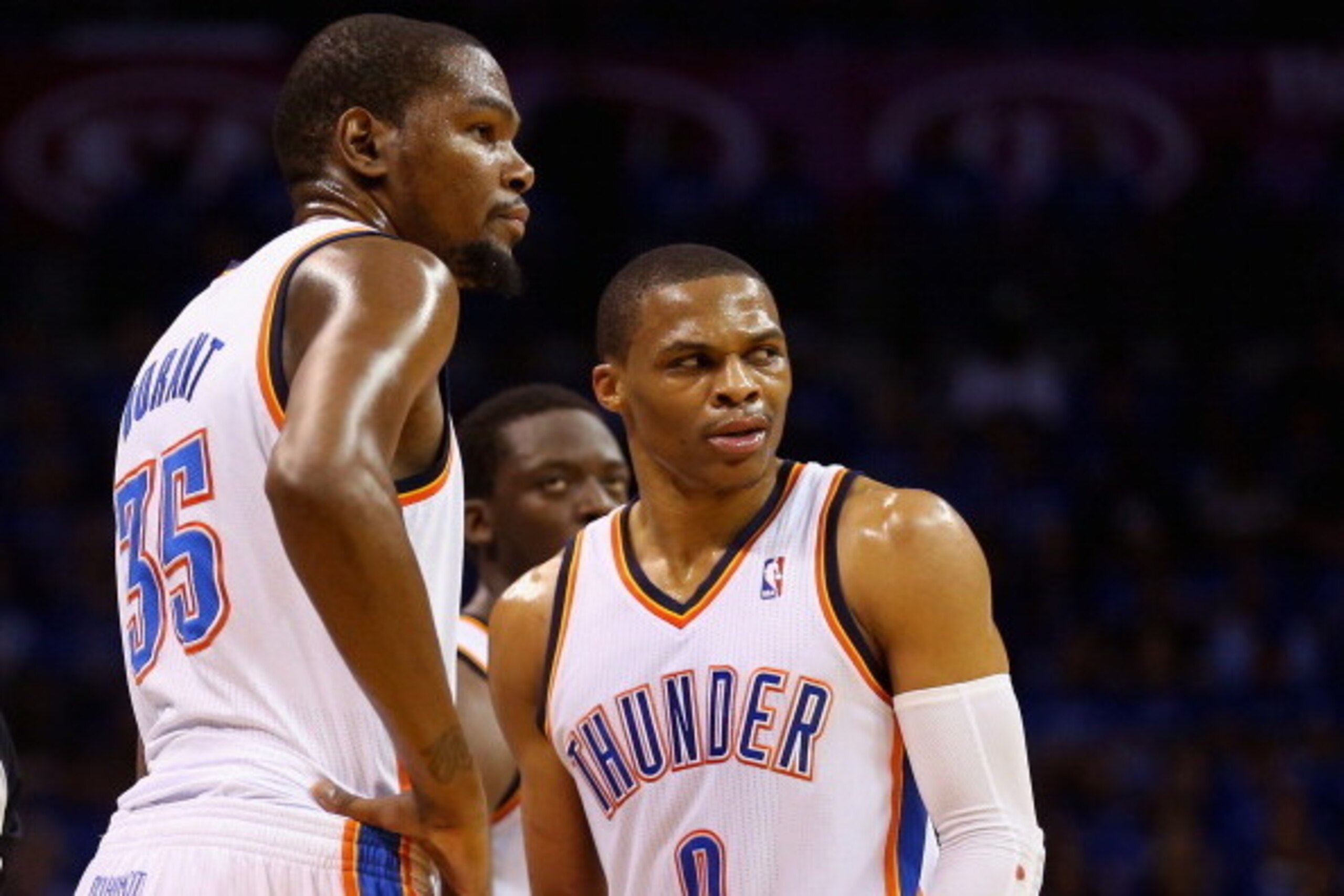 OKLAHOMA CITY, OK - MAY 25: Kevin Durant #35 and Russell Westbrook #0 of the Oklahoma City Thunder look on after a call in the second quarter against the San Antonio Spurs during Game Three of the Western Conference Finals of the 2014 NBA Playoffs at Ches