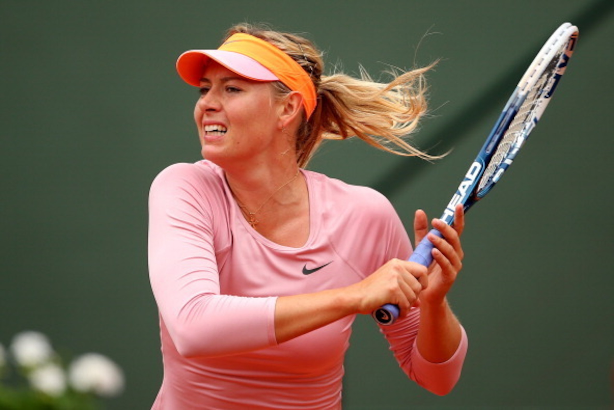 PARIS, FRANCE - MAY 26:  Maria Sharapova of Russia returns a shot during her women's singles match against Ksenia Pervak of Russia on day two of the French Open at Roland Garros on May 26, 2014 in Paris, France.  (Photo by Clive Brunskill/Getty Images)