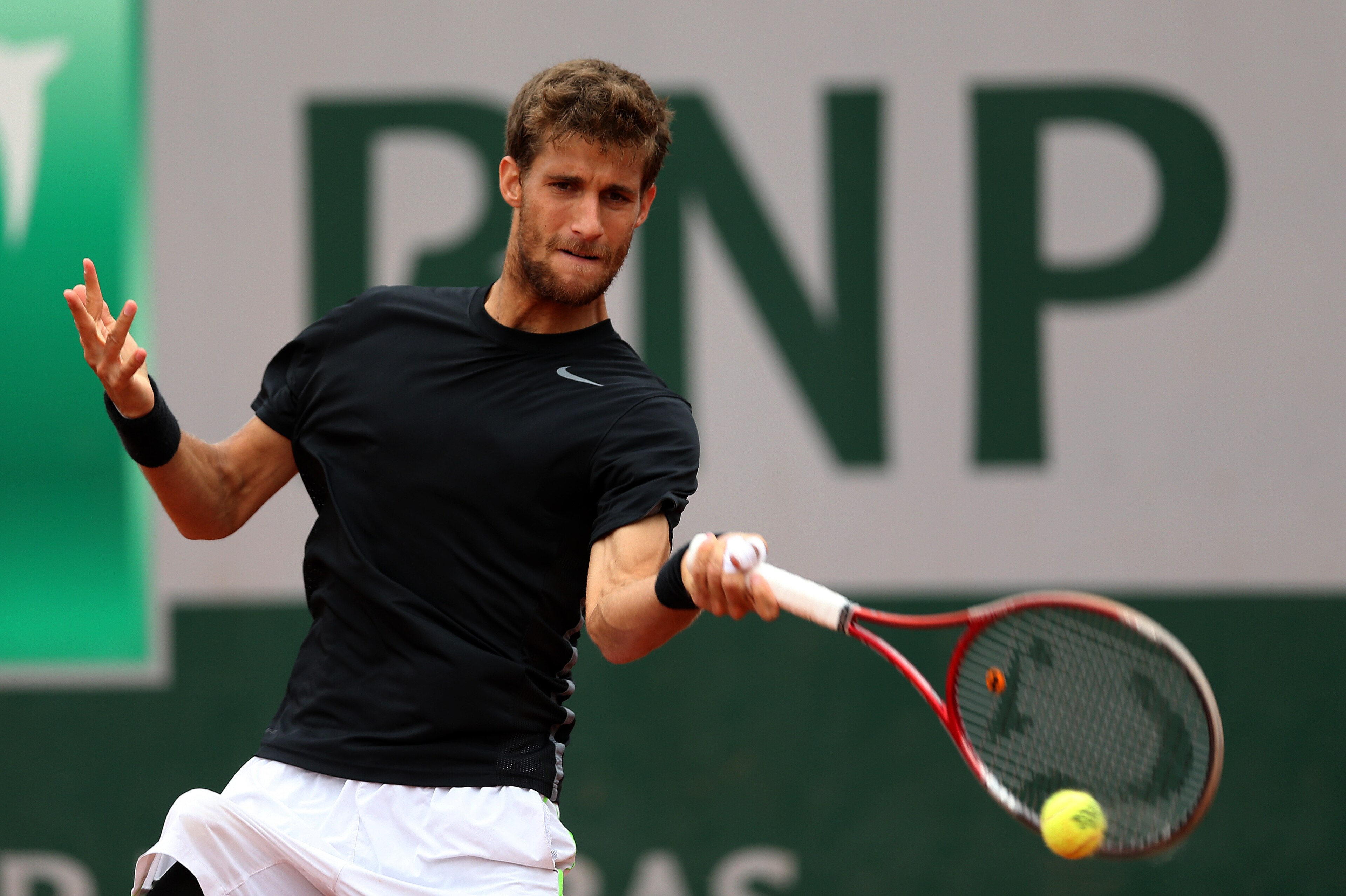 PARIS, FRANCE - MAY 26:  Martin Klizan of Slovakia returns a shot during his men's singles match against Kei Nishikori of Japan on day two of the French Open at Roland Garros on May 26, 2014 in Paris, France.  (Photo by Matthew Stockman/Getty Images)