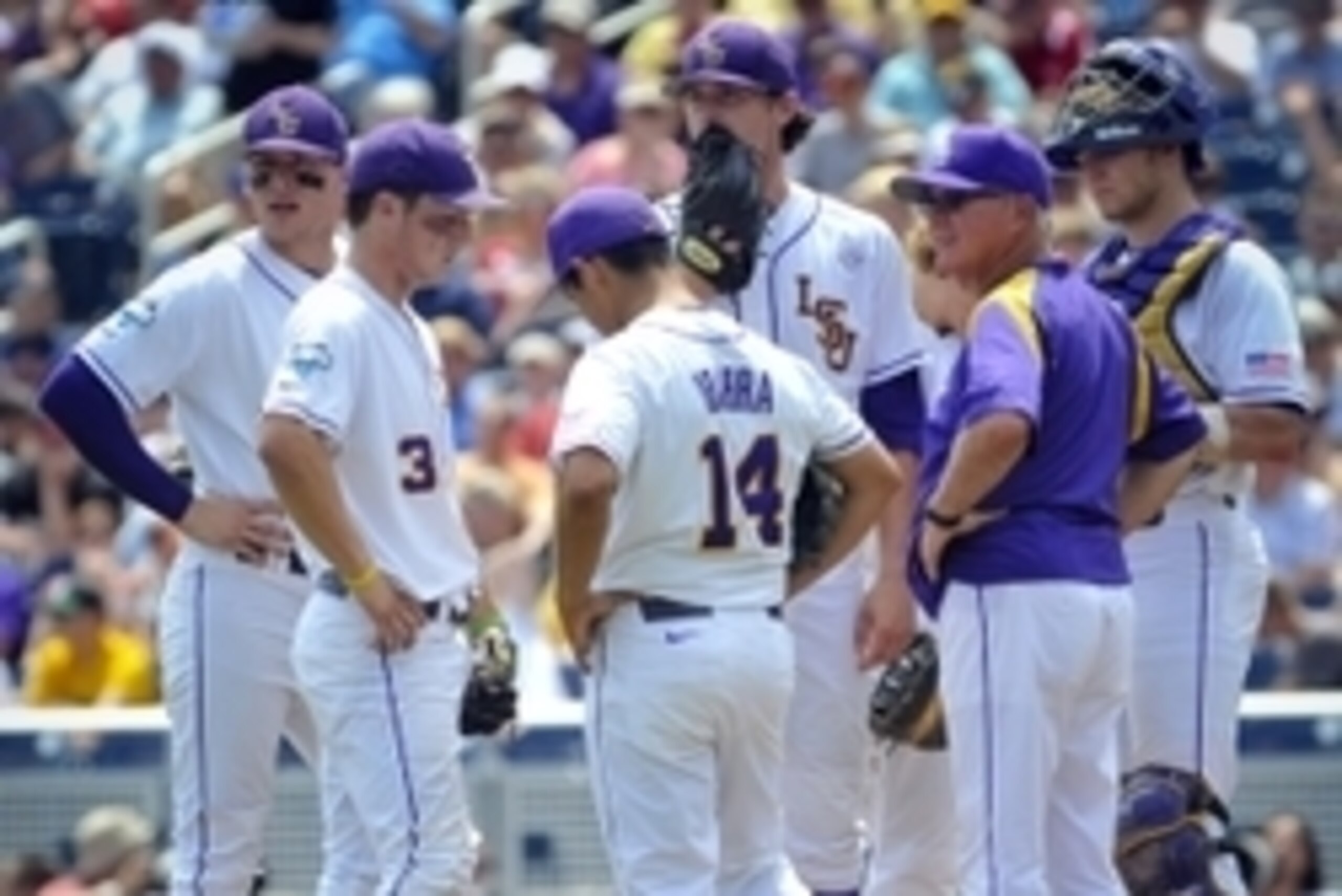 Jun 18, 2013; Omaha, NE, USA; LSU Tigers head coach Paul Mainieri makes a pitching change during their College World Series game against the North Carolina Tar Heels at TD Ameritrade Park. Mandatory Credit: Dave Weaver-USA Today Sports