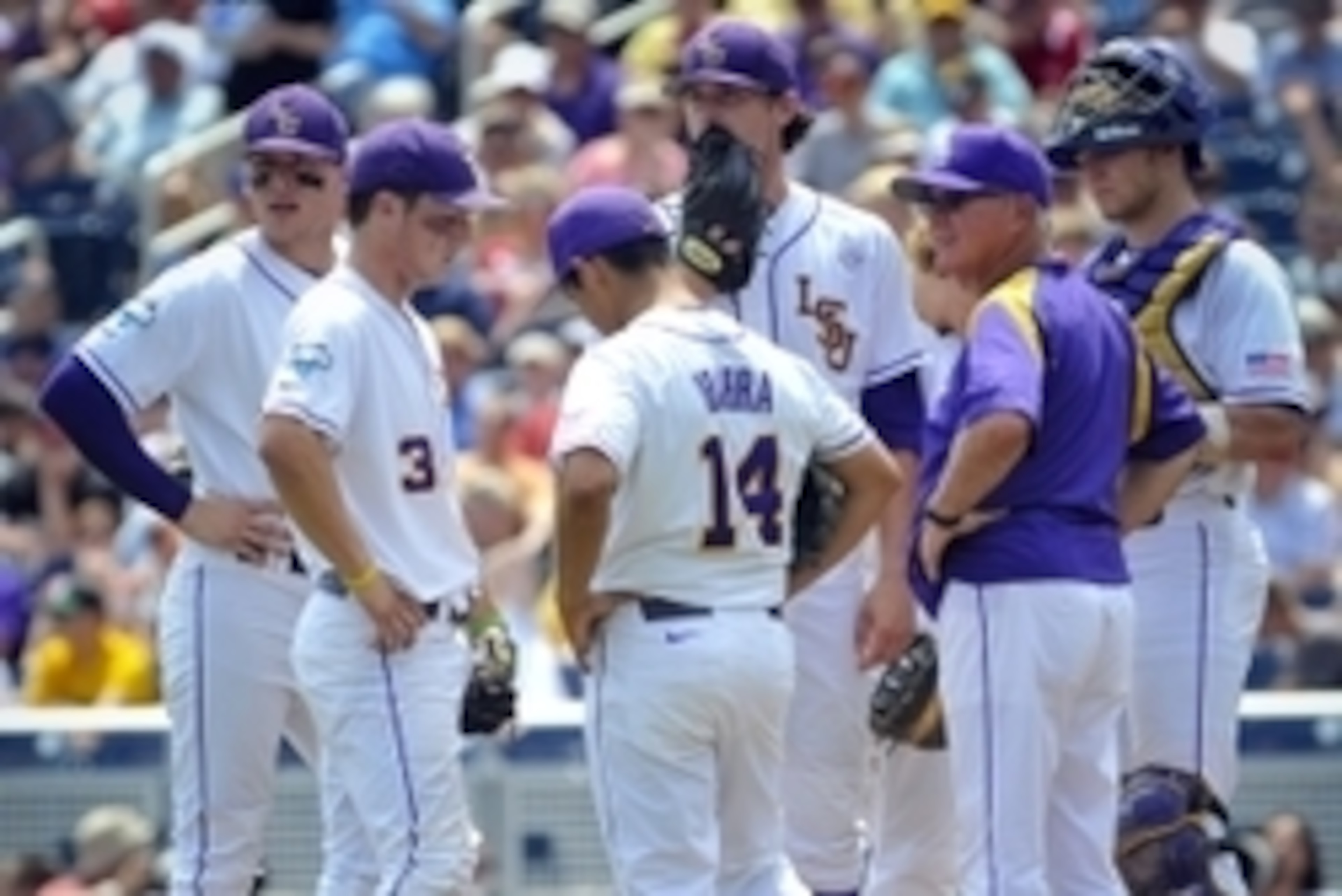 Jun 18, 2013; Omaha, NE, USA; LSU Tigers head coach Paul Mainieri makes a pitching change during their College World Series game against the North Carolina Tar Heels at TD Ameritrade Park. Mandatory Credit: Dave Weaver-USA Today Sports