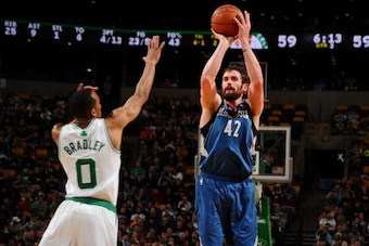BOSTON, MA - DECEMBER 16: Kevin Love #42 of the Minnesota Timberwolves shoots the ball against Avery Bradley #0 of the Boston Celtics on December 16, 2013 at the TD Garden in Boston, Massachusetts.  NOTE TO USER: User expressly acknowledges and agrees tha