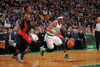BOSTON, MA - MARCH 26: Rajon Rondo #9 of the Boston Celtics drives against the Toronto Raptors on March 26, 2014 at the TD Garden in Boston, Massachusetts.  NOTE TO USER: User expressly acknowledges and agrees that, by downloading and or using this photog