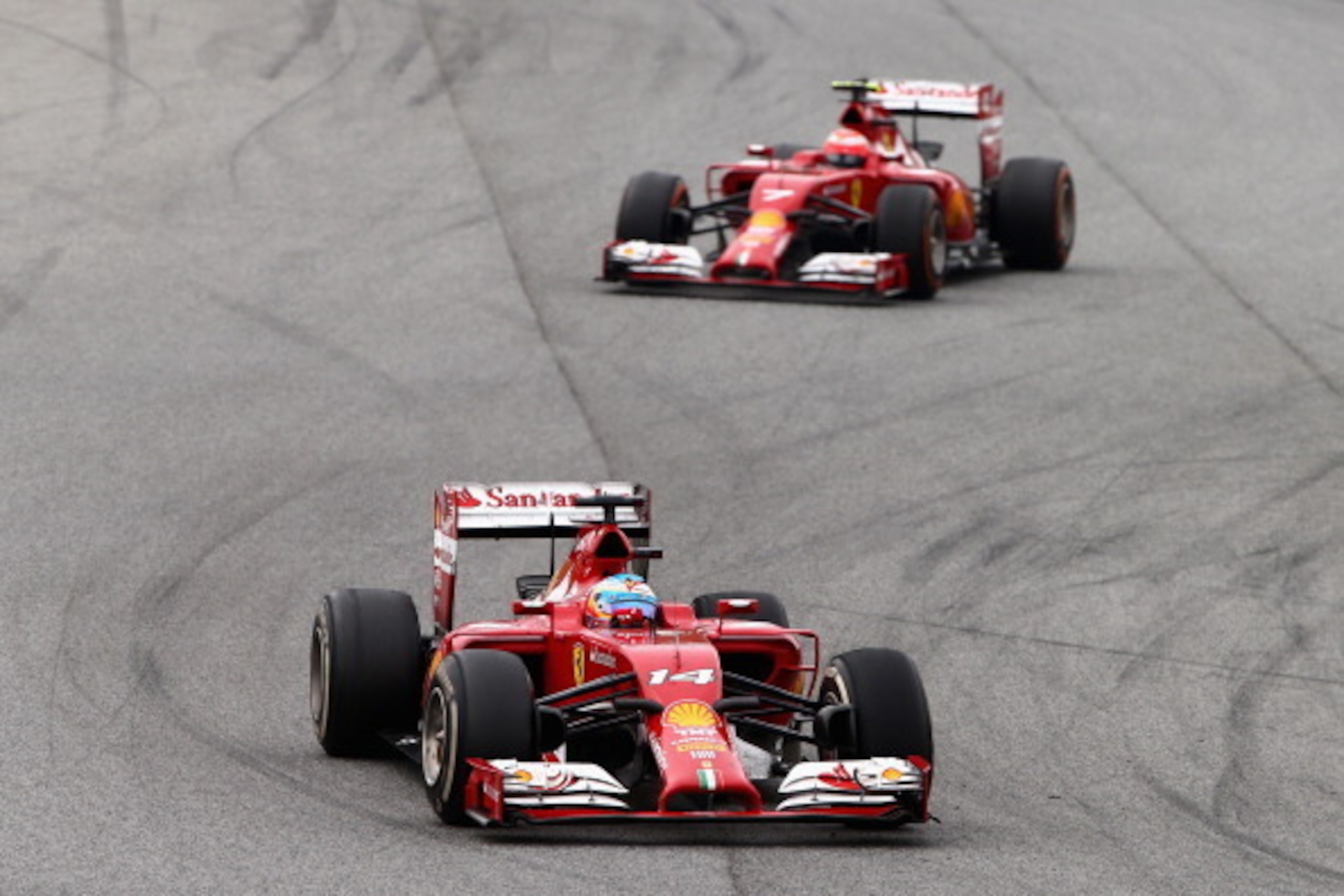 MONTMELO, SPAIN - MAY 11:  Fernando Alonso of Spain and Ferrari leads Kimi Raikkonen of Finland and Ferrari during the Spanish Formula One Grand Prix at Circuit de Catalunya on May 11, 2014 in Montmelo, Spain.  (Photo by Clive Mason/Getty Images)