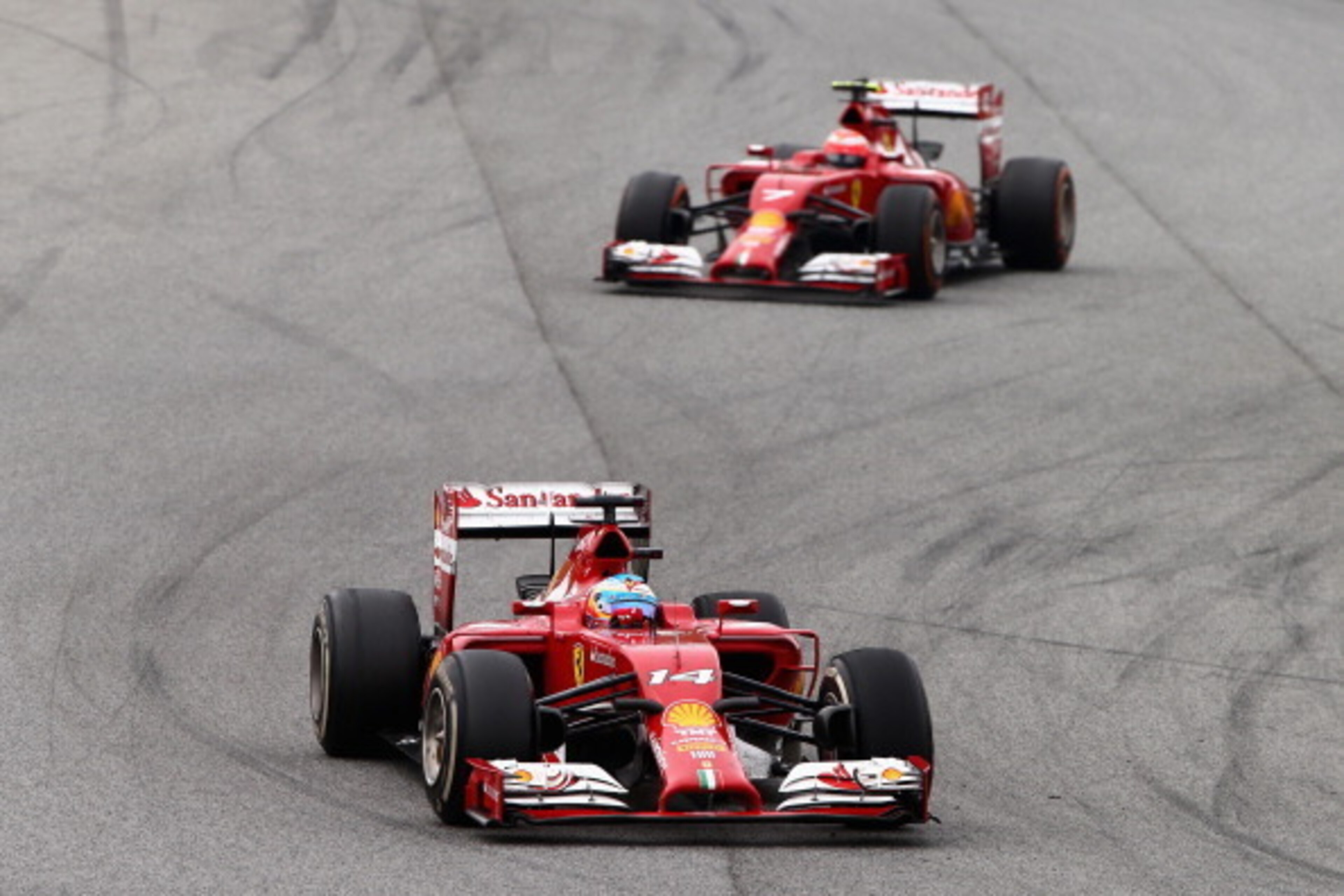MONTMELO, SPAIN - MAY 11:  Fernando Alonso of Spain and Ferrari leads Kimi Raikkonen of Finland and Ferrari during the Spanish Formula One Grand Prix at Circuit de Catalunya on May 11, 2014 in Montmelo, Spain.  (Photo by Clive Mason/Getty Images)