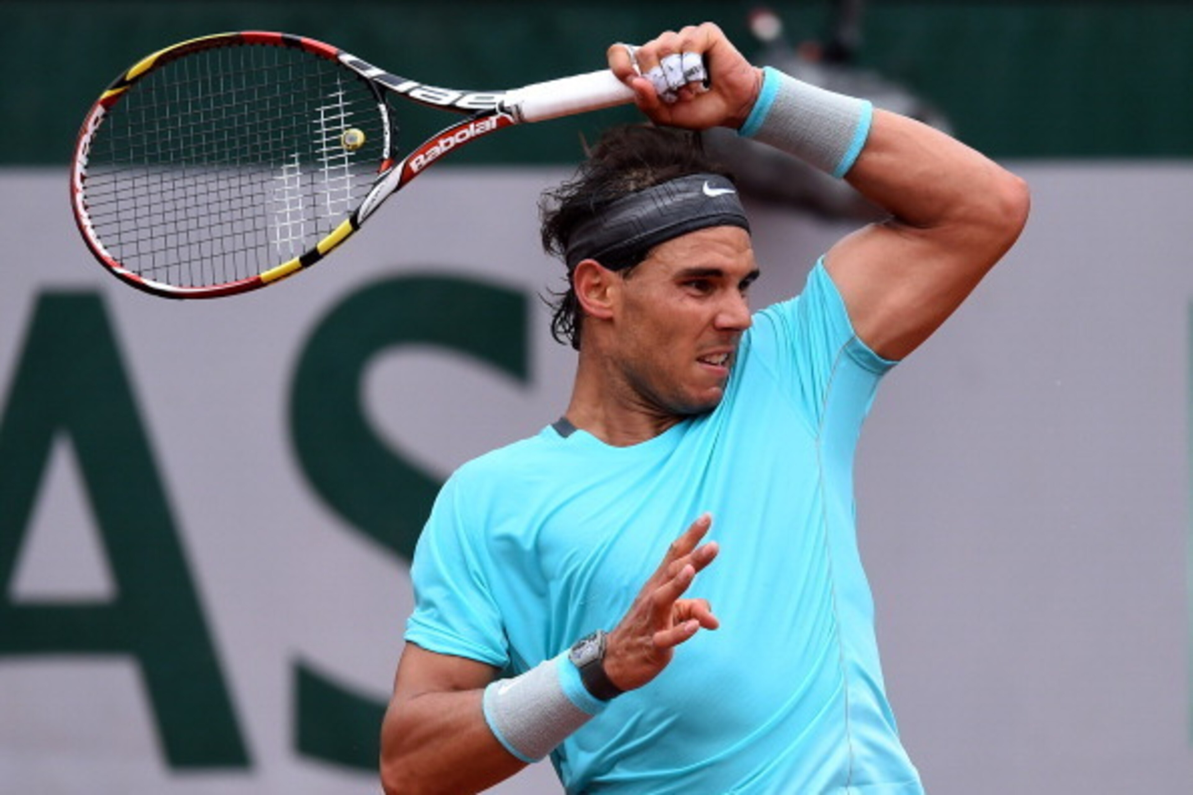PARIS, FRANCE - MAY 26:  Rafael Nadal of Spain returns a shot during his men's singles match against Robby Ginepri of the United States on day two of the French Open at Roland Garros on May 26, 2014 in Paris, France.  (Photo by Matthias Hangst/Getty Image
