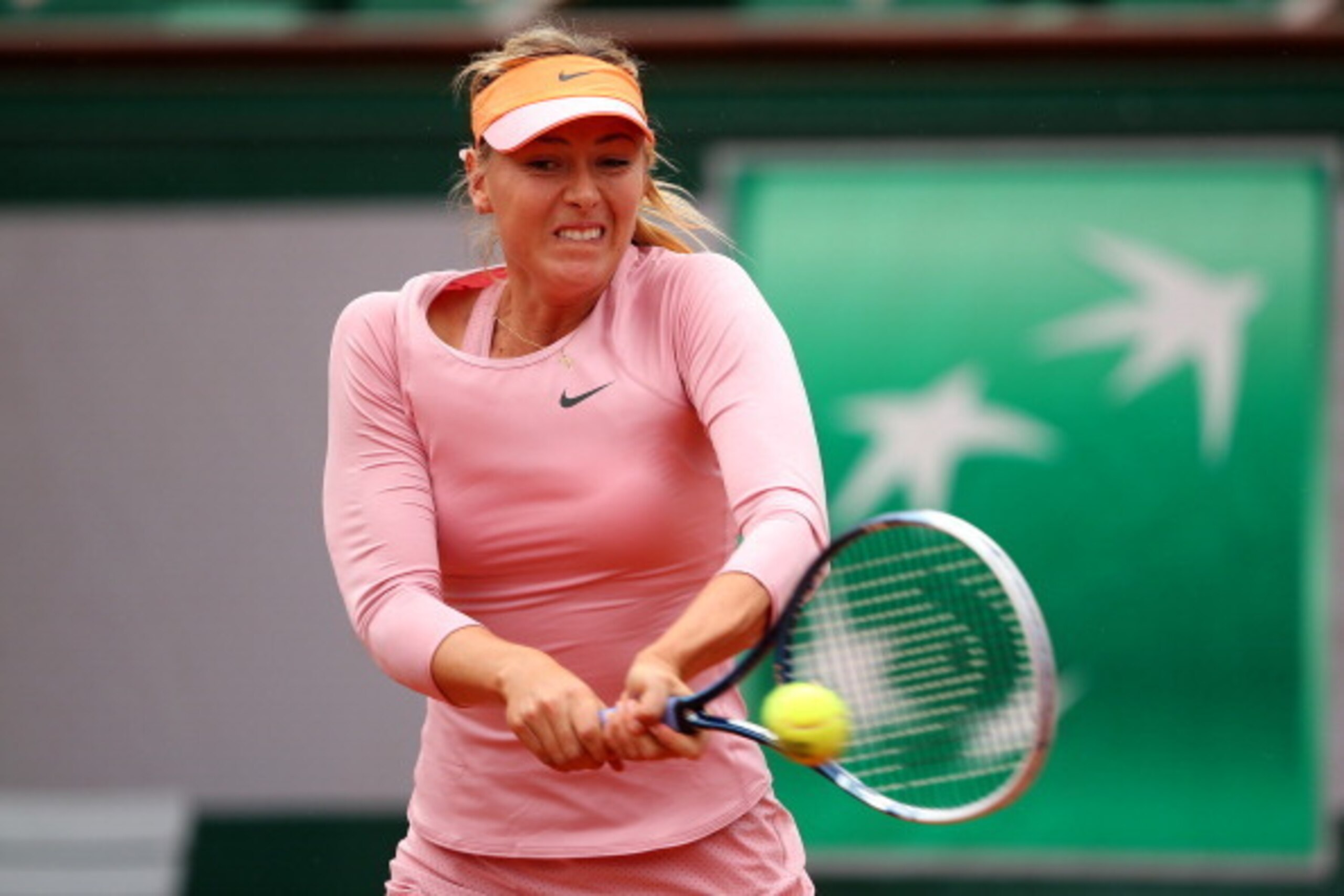 PARIS, FRANCE - MAY 26:  Maria Sharapova of Russia returns a shot during her women's singles match against Ksenia Pervak of Russia on day two of the French Open at Roland Garros on May 26, 2014 in Paris, France.  (Photo by Clive Brunskill/Getty Images)