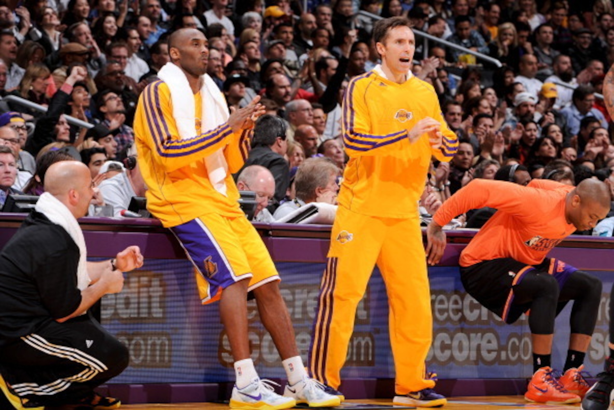LOS ANGELES, CA - FEBRUARY 12: Kobe Bryant #24 and Steve Nash #10 of the Los Angeles Lakers cheer their team on as they wait to check in against the Phoenix Suns at Staples Center on February 12, 2013 in Los Angeles, California. NOTE TO USER: User express