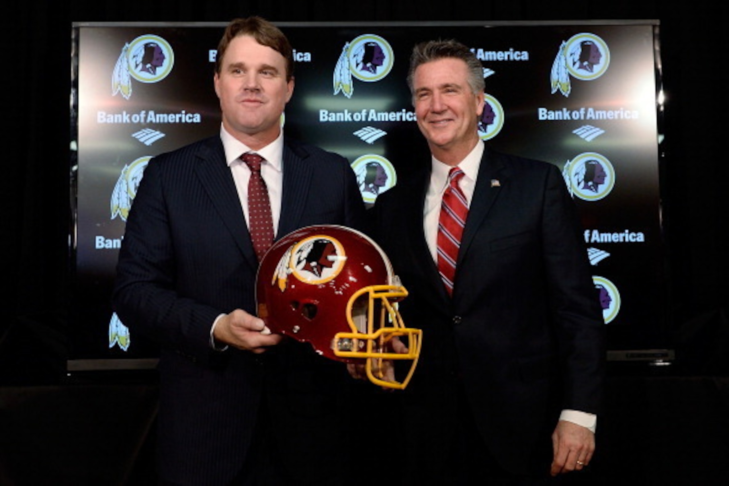 ASHBURN, VA - JANUARY 09:  Jay Gruden (L) poses for a photo with Washington Redskins Executive Vice President and and General Manager Bruce Allen after he was introduced as the new head coach of the Washington Redskins during a press conference at Redskin