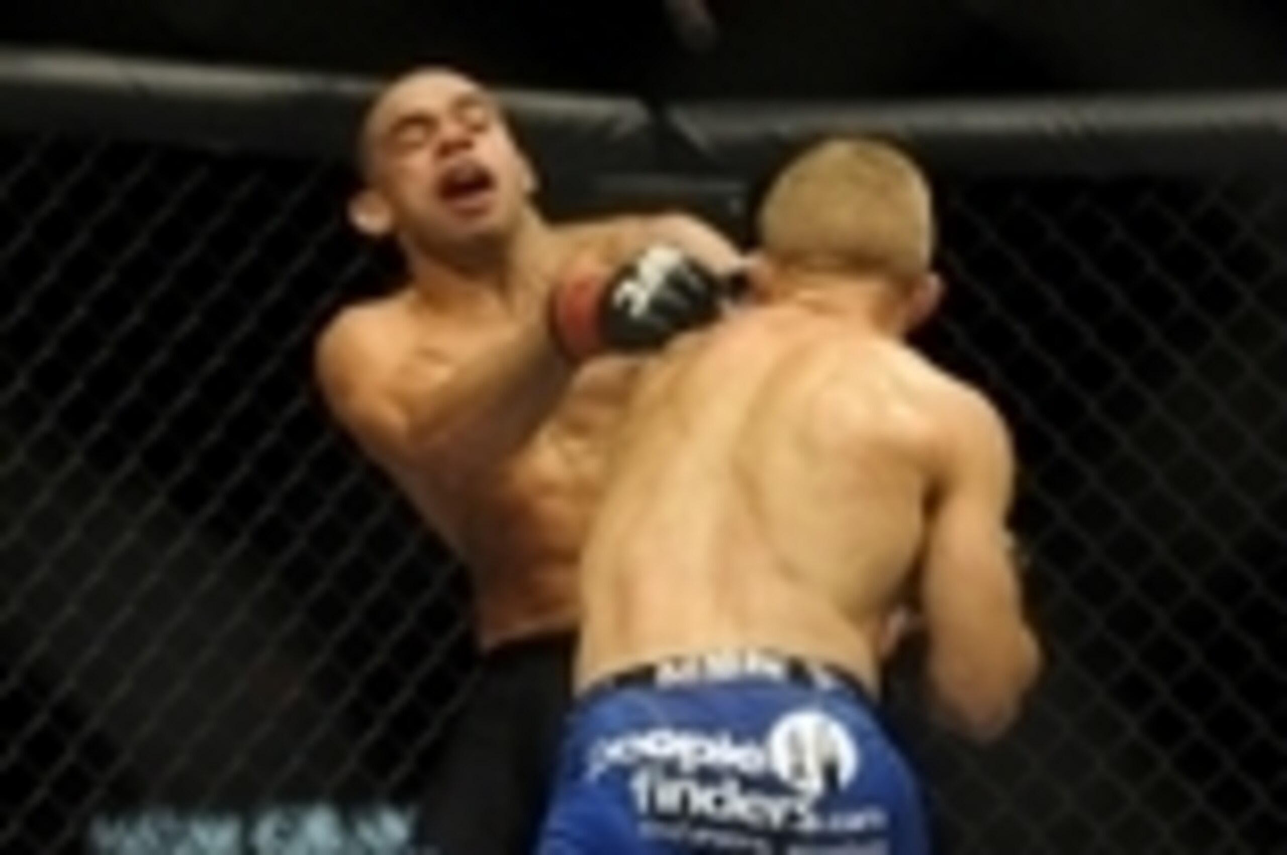 May 24, 2014; Las Vegas, NV, USA;   TJ Dillashaw (blue) throws a punch at  Renan Barao (red) during their UFC 173 bantamweight championship bout at MGM Grand Garden Arena. Dillashaw won the bout by way of TKO. Mandatory Credit: Stephen R. Sylvanie-USA TOD
