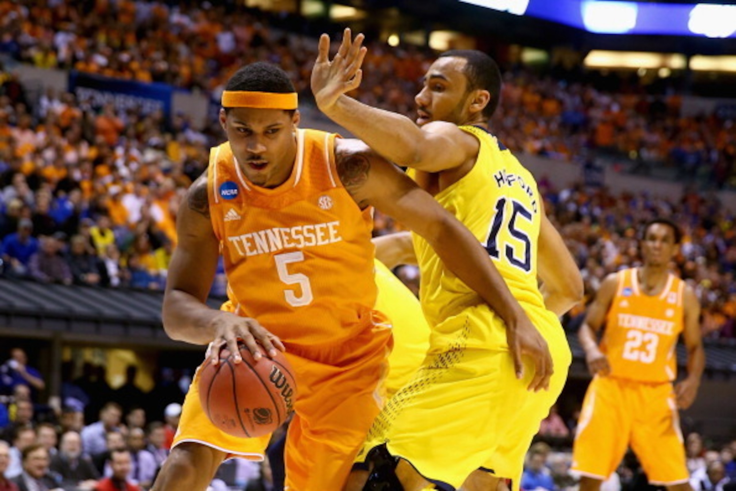 INDIANAPOLIS, IN - MARCH 28: Jarnell Stokes #5 of the Tennessee Volunteers drives to the basket against Jon Horford #15 of the Michigan Wolverines during the regional semifinal of the 2014 NCAA Men's Basketball Tournament at Lucas Oil Stadium on March 28 INDIANAPOLIS, IN - MARCH 28: Jarnell Stokes #5 of the Tennessee Volunteers drives to the basket against Jon Horford #15 of the Michigan Wolverines during the regional semifinal of the 2014 NCAA Men's Basketball Tournament at Lucas Oil Stadium on March 28