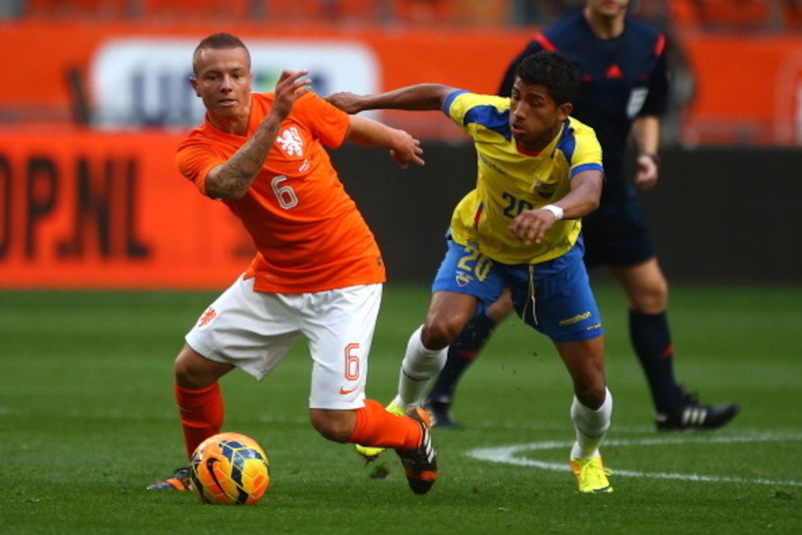 AMSTERDAM, NETHERLANDS - MAY 17: Jordy Clasie of Holland looks to hold of Ecuador's Joao Rojas during the International Friendly match between The Netherlands and Ecuador at The Amsterdam Arena on May 17, 2014 in Amsterdam, Netherlands. (Photo by Charlie 