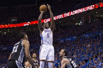 OKLAHOMA CITY, OK - May 25:  Serge Ibaka #9 of the Oklahoma City Thunder takes a shot against the San Antonio Spurs in Game 3 of the Western Conference Finals during the 2014 NBA Playoffs at the Chesapeake Arena on May 25, 2014 in Oklahoma City, Oklahoma.