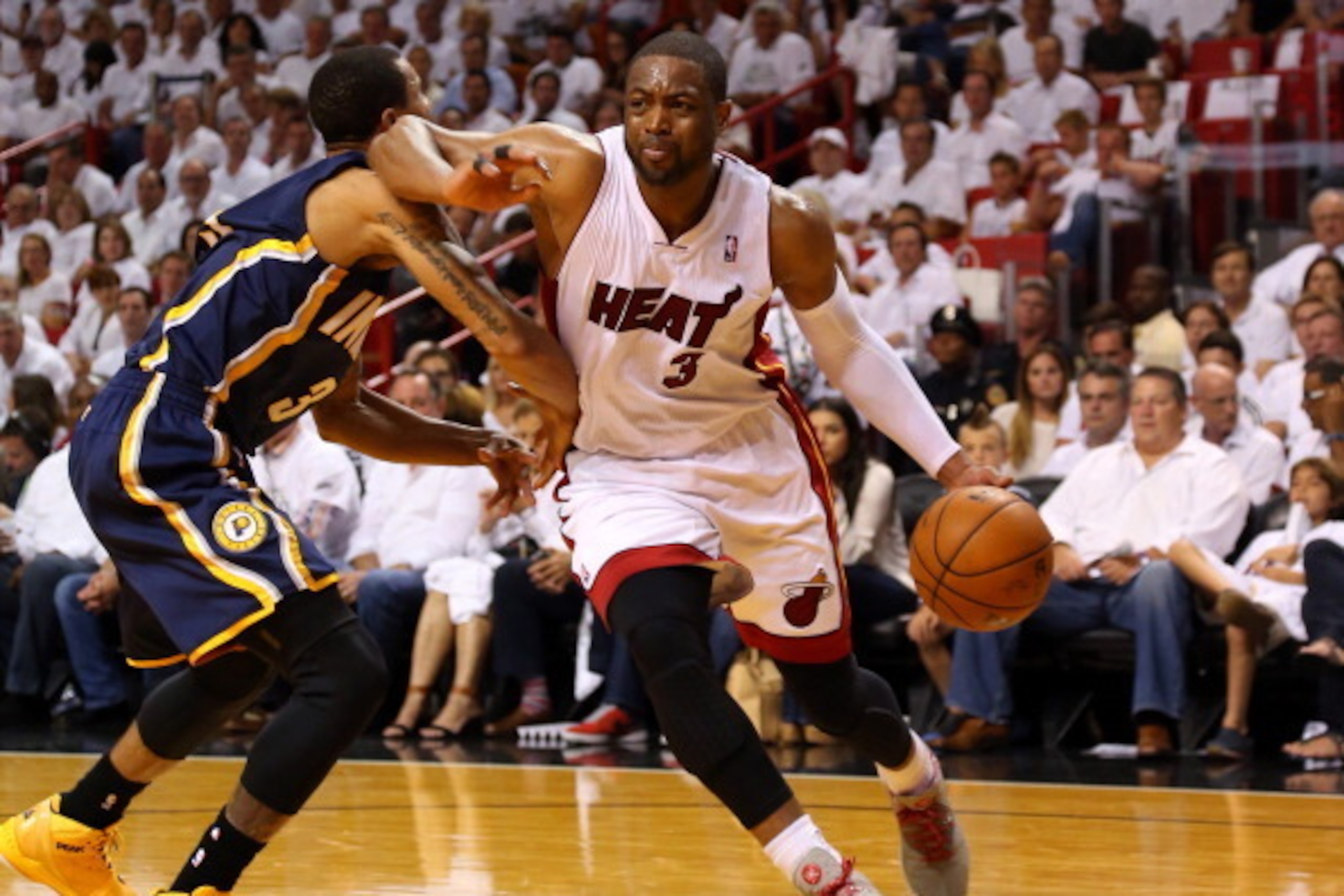MIAMI, FL - MAY 26: Dwyane Wade #3 of the Miami Heat drives to the basket as George Hill #3 of the Indiana Pacers defends during Game Four of the Eastern Conference Finals of the 2014 NBA Playoffs at American Airlines Arena on May 26, 2014 in Miami, Flori MIAMI, FL - MAY 26: Dwyane Wade #3 of the Miami Heat drives to the basket as George Hill #3 of the Indiana Pacers defends during Game Four of the Eastern Conference Finals of the 2014 NBA Playoffs at American Airlines Arena on May 26, 2014 in Miami, Flori