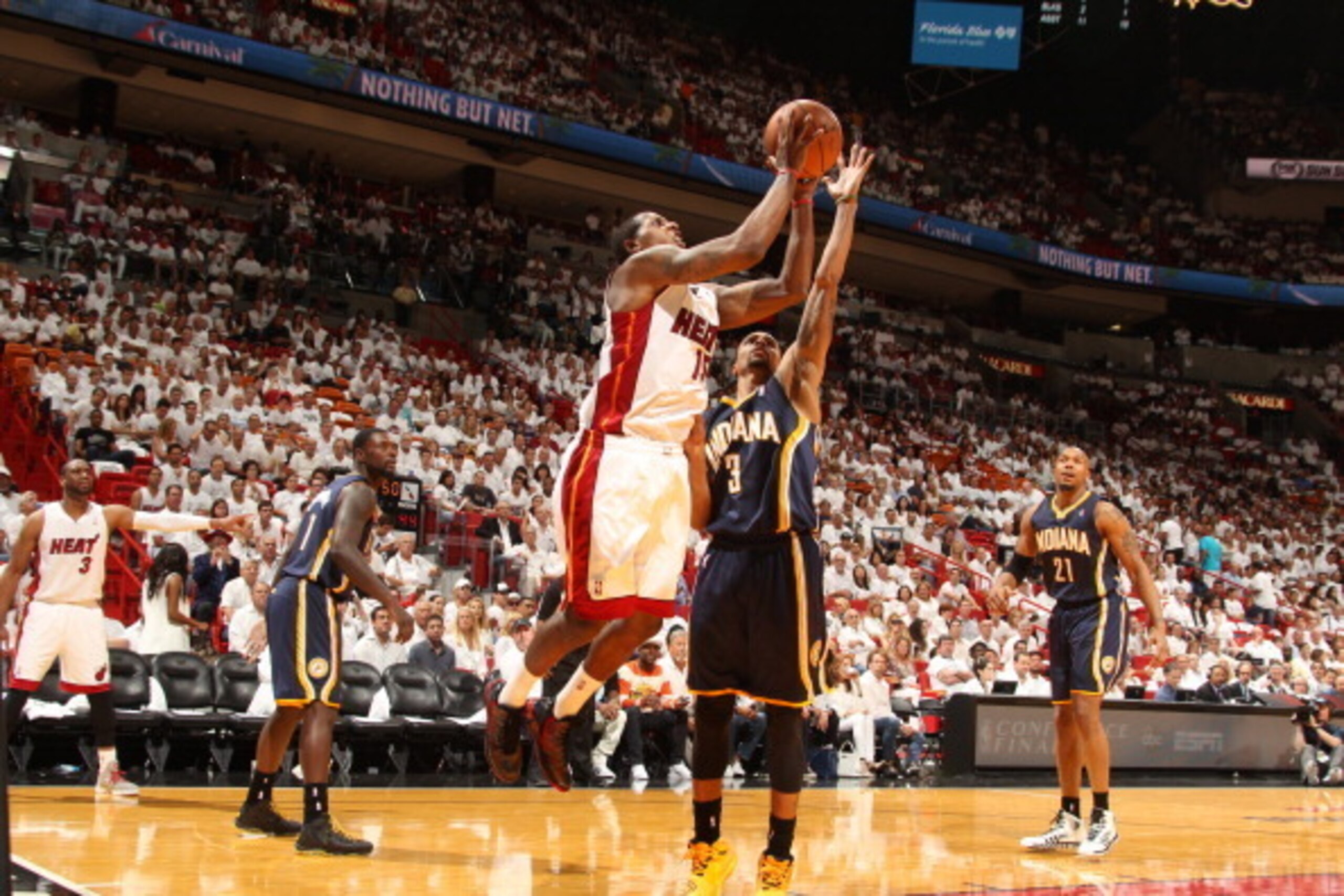 MIAMI, FL - May 26: Mario Chalmers #15 of the Miami Heat shoots against the Indiana Pacers in Game Four of the Eastern Conference Finals during the 2014 NBA Playoffs at the American Airlines Arena in Miami, Florida on May 26, 2014. NOTE TO USER: User expr