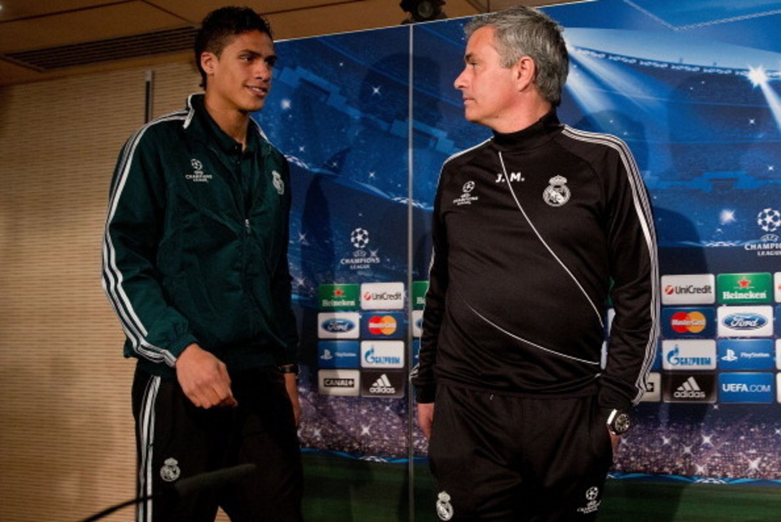 MADRID, SPAIN - APRIL 02:  Head coach Jose Mourinho (R) and Real madrid player Raphael varane prior to start a press conference ahead of the UEFA Champions League Quarterfinal match between Real Madrid and Galatasaray AS at Santiago Bernabeu Stadium on Ap