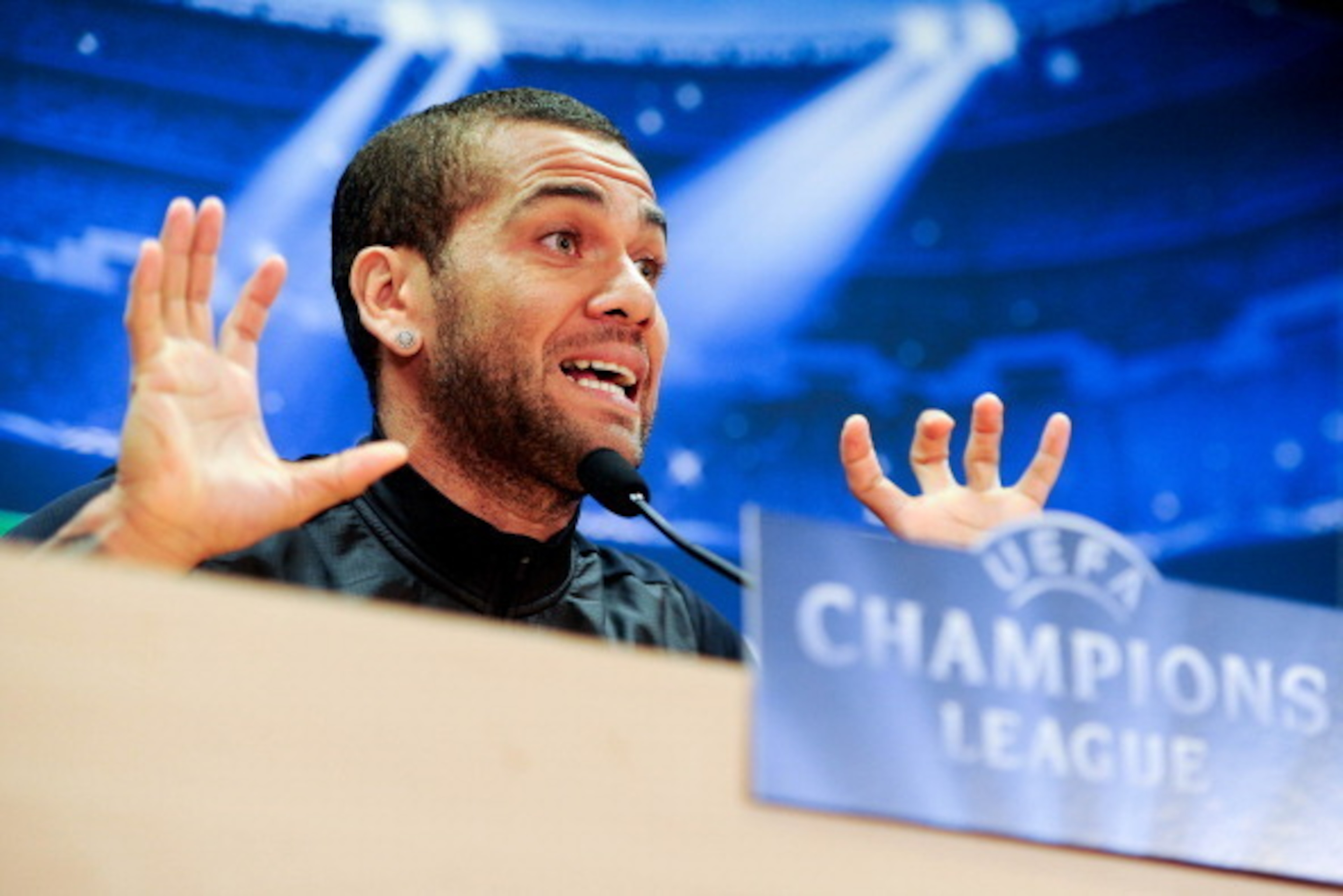 BARCELONA, SPAIN - MARCH 31:  Dani Alves of FC Barcelona faces the media during a press conference ahead the UEFA Champions League Quarter Final first leg match against Atletico de Madrid at Sant Joan Despi Sport Complex on March 31, 2014 in Barcelona, Sp