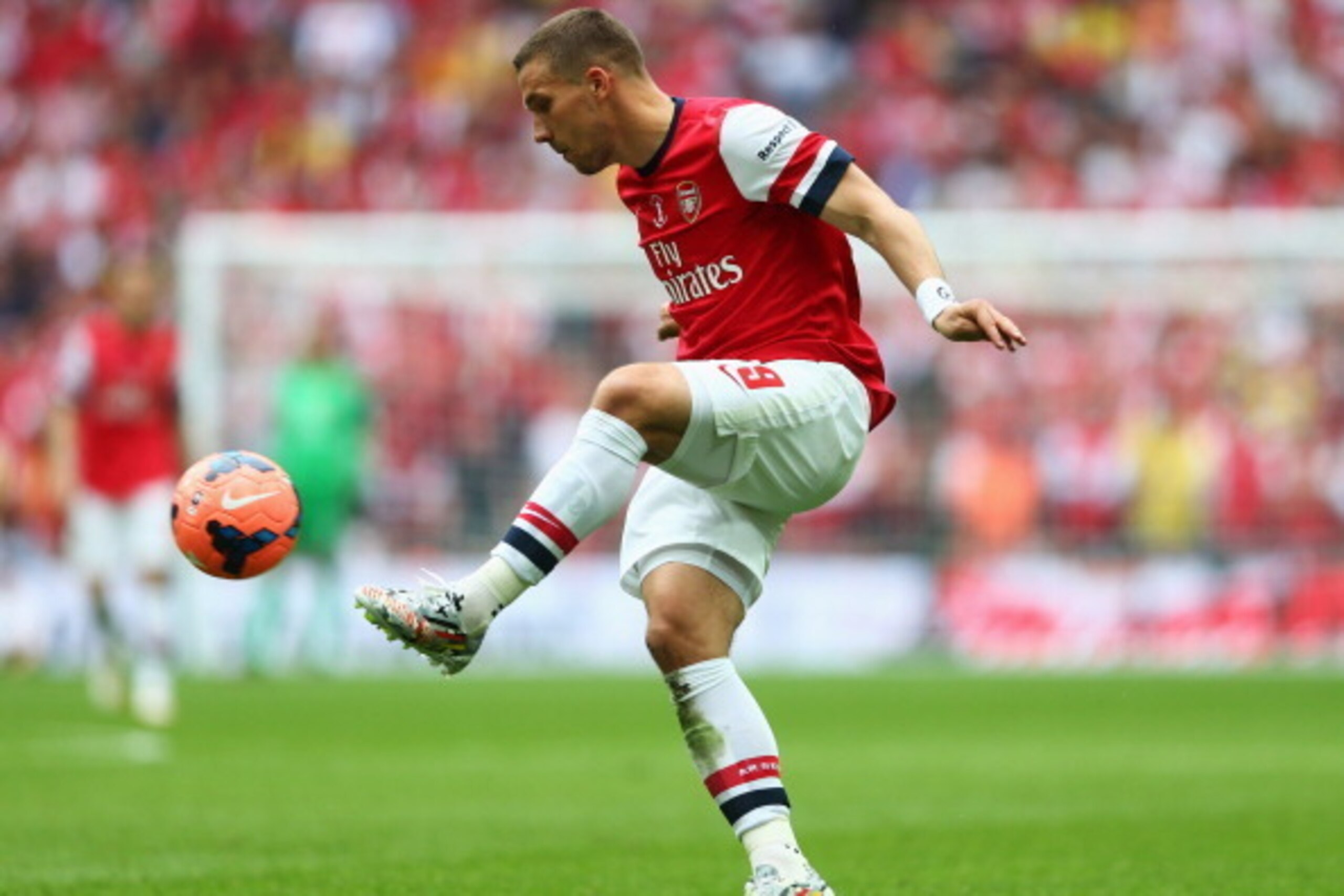 LONDON, ENGLAND - MAY 17:  Lukas Podolski of Arsenal in action during the FA Cup with Budweiser Final match between Arsenal and Hull City at Wembley Stadium on May 17, 2014 in London, England.  (Photo by Paul Gilham/Getty Images)
