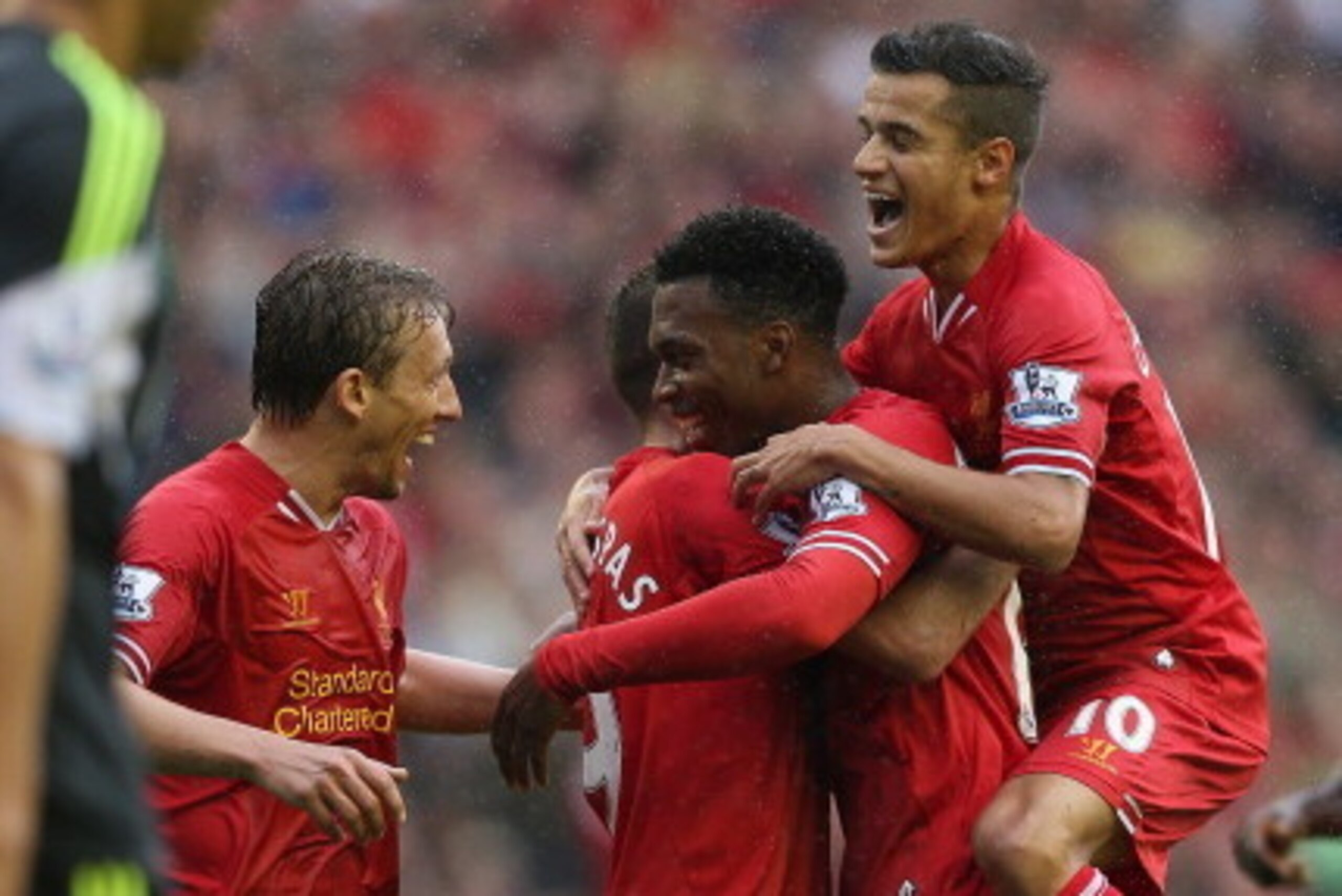 LIVERPOOL, ENGLAND - AUGUST 17:  Daniel Sturridge of Liverpool is congratulated by Iago Aspas,Lucas,Philuppe Coutinho and Kolo Toure after scoring the first goal during the Barclays Premier League match between Liverpool and Stoke City at Anfield on Augus