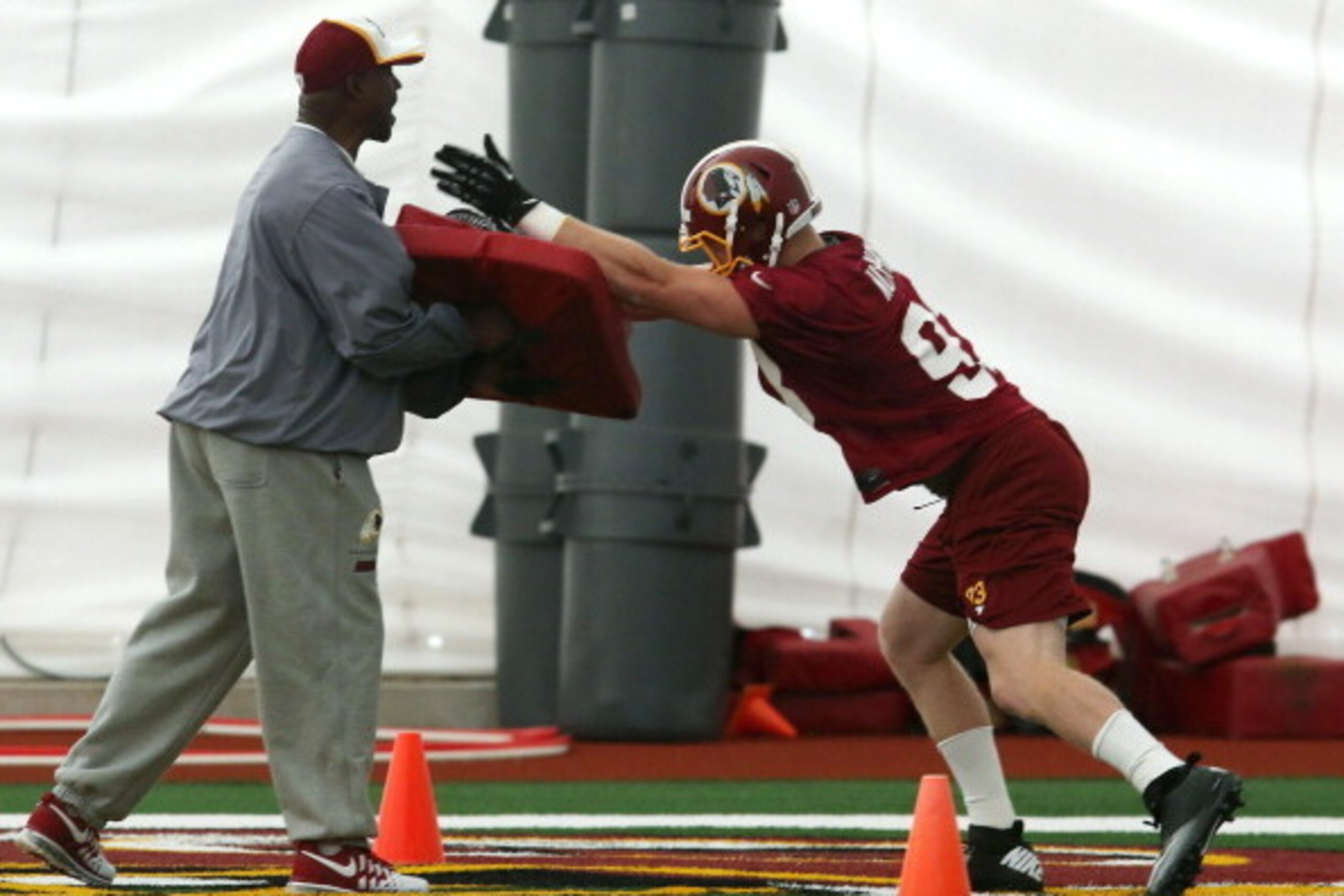 ASHBURN, VA - MAY 17:  Trent Murphy #93 works out during Washington Redskins rookie minicamp at Redskins Park on May 17, 2014 in Ashburn, Virginia.  (Photo by Mark Wilson/Getty Images)