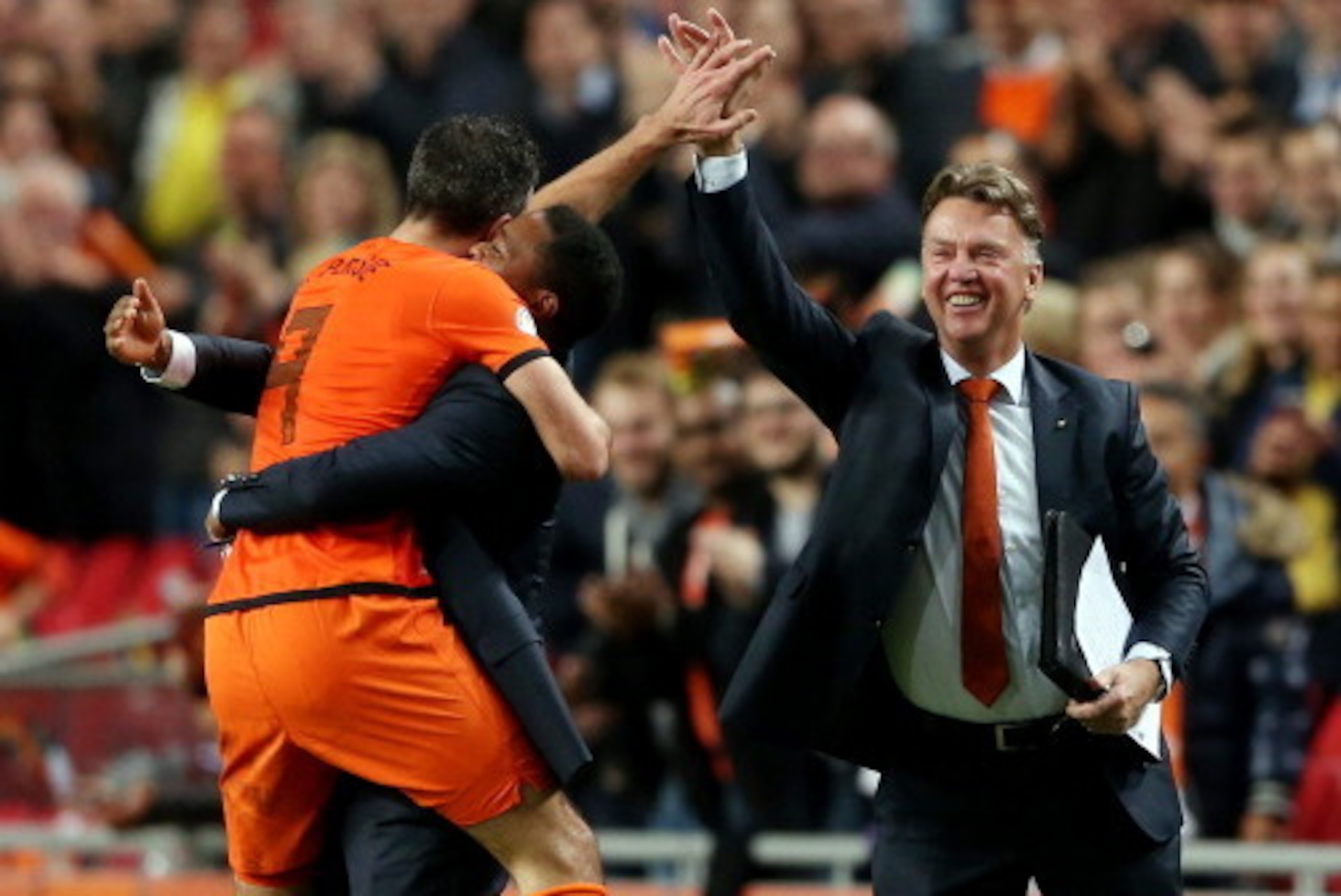 AMSTERDAM, NETHERLANDS - OCTOBER 11:  Robin van Persie of Holland celebrates with Patrick Kluivert and manager Luis van Gaal after scoring their fourth goal during the FIFA 2014 World Cup Qualifing match between Holland and Hungary at Amsterdam Arena on O