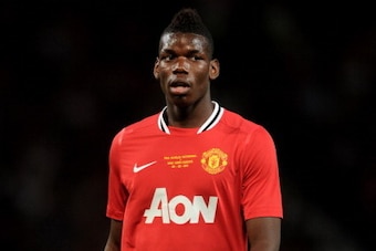 MANCHESTER, ENGLAND - AUGUST 05:  Paul Pogba of Manchester United looks on during Paul Scholes' Testimonial Match between Manchester United and New York Cosmos at Old Trafford on August 5, 2011 in Manchester, England.  (Photo by Chris Brunskill/Getty Imag