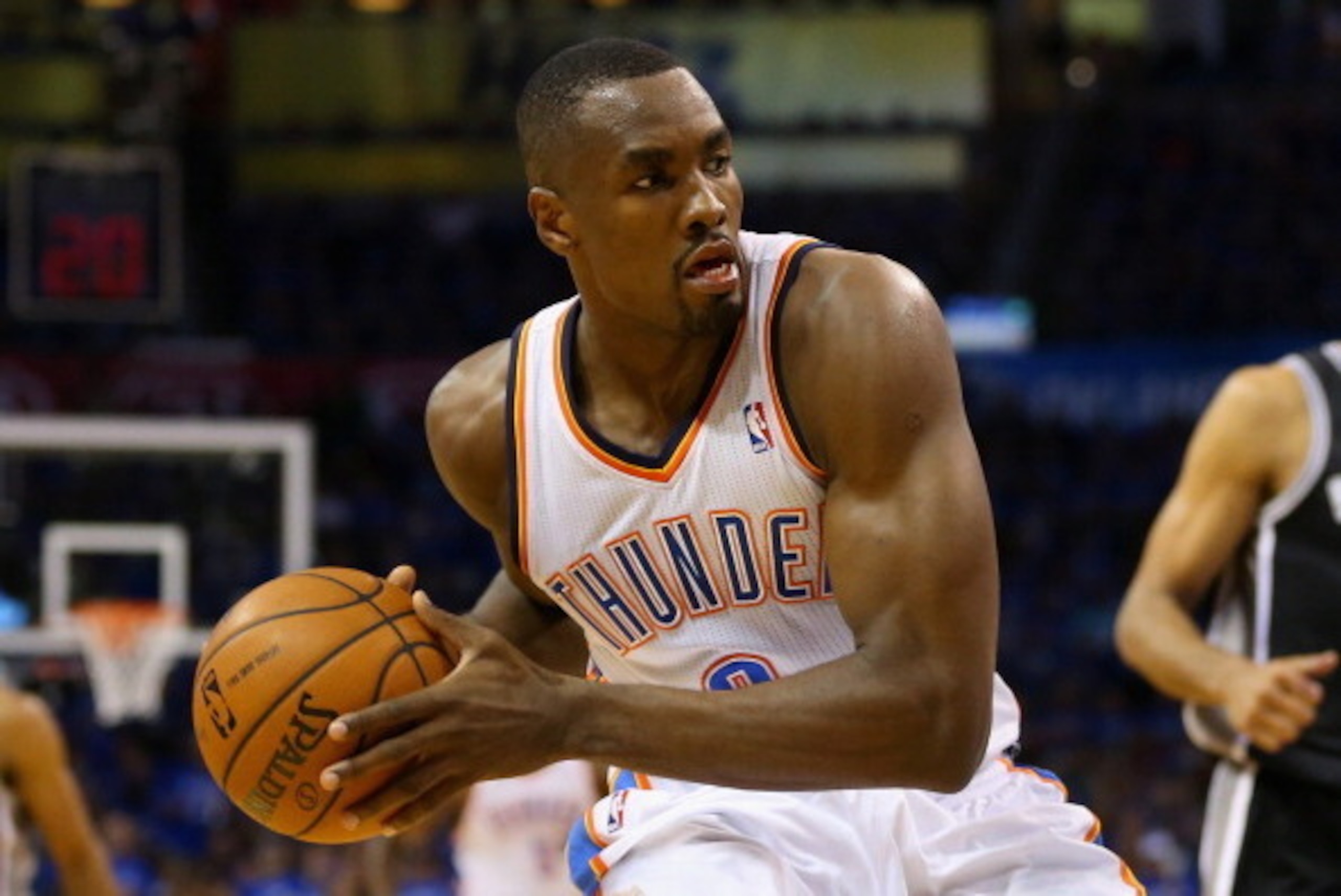 OKLAHOMA CITY, OK - MAY 25: Serge Ibaka #9 of the Oklahoma City Thunder handles the ball in the third quarter against the San Antonio Spurs during Game Three of the Western Conference Finals of the 2014 NBA Playoffs at Chesapeake Energy Arena on May 25, 2