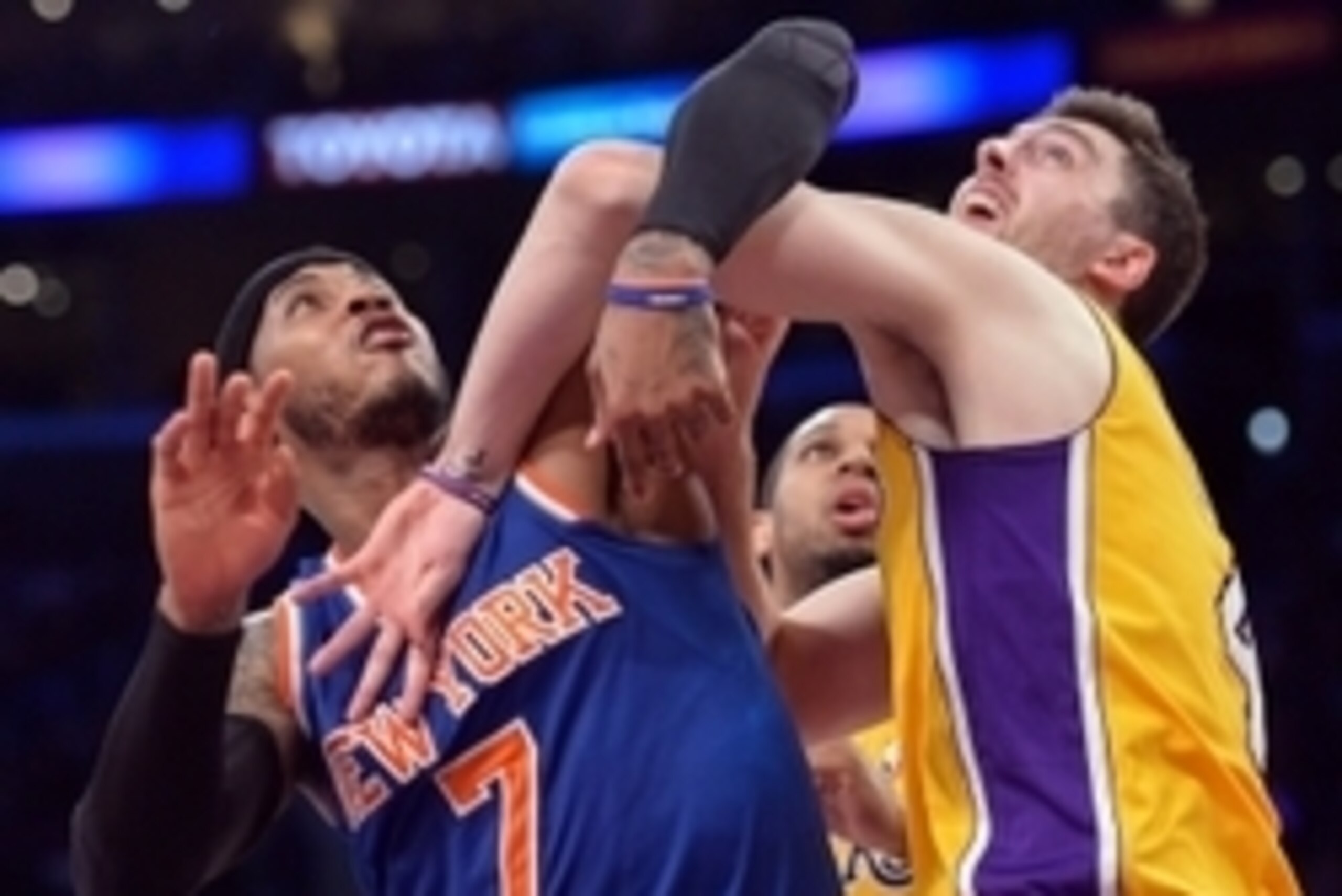 Mar 25, 2014; Los Angeles, CA, USA; New York Knicks forward Carmelo Anthony (7) battles Los Angeles Lakers forward Ryan Kelly (4) for rebounding position under the basket during the second quarter at Staples Center. Mandatory Credit: Robert Hanashiro-USA 