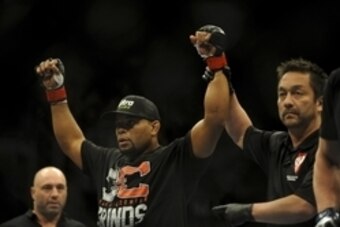 Feb 22, 2014; Las Vegas, NV, USA;  Daniel Cormier (red gloves) celebrates his victory of Pactrick Cummins (not pictured) after their UFC light heavyweight bout at Mandalay Bay. Cormier won by way of a TKO in the first round. Mandatory Credit: Stephen R. S