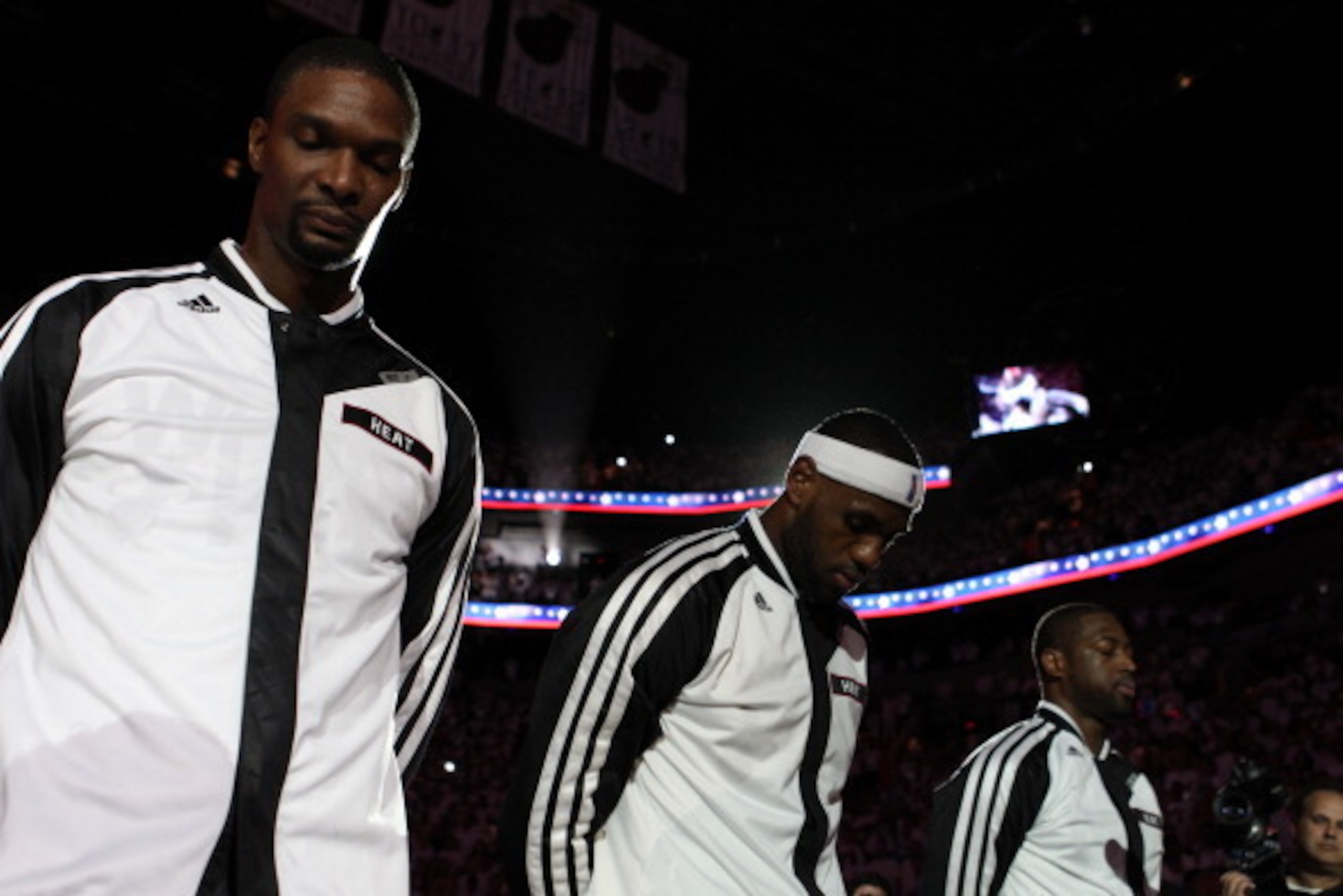MIAMI, FL - May 26: LeBron James #6, Chris Bosh #1, and Dwyane Wade #3 of the Miami Heat stand during the National Anthem before Game Four of the Eastern Conference Finals against the Indiana Pacers during the 2014 NBA Playoffs at the American Airlines Ar MIAMI, FL - May 26: LeBron James #6, Chris Bosh #1, and Dwyane Wade #3 of the Miami Heat stand during the National Anthem before Game Four of the Eastern Conference Finals against the Indiana Pacers during the 2014 NBA Playoffs at the American Airlines Ar