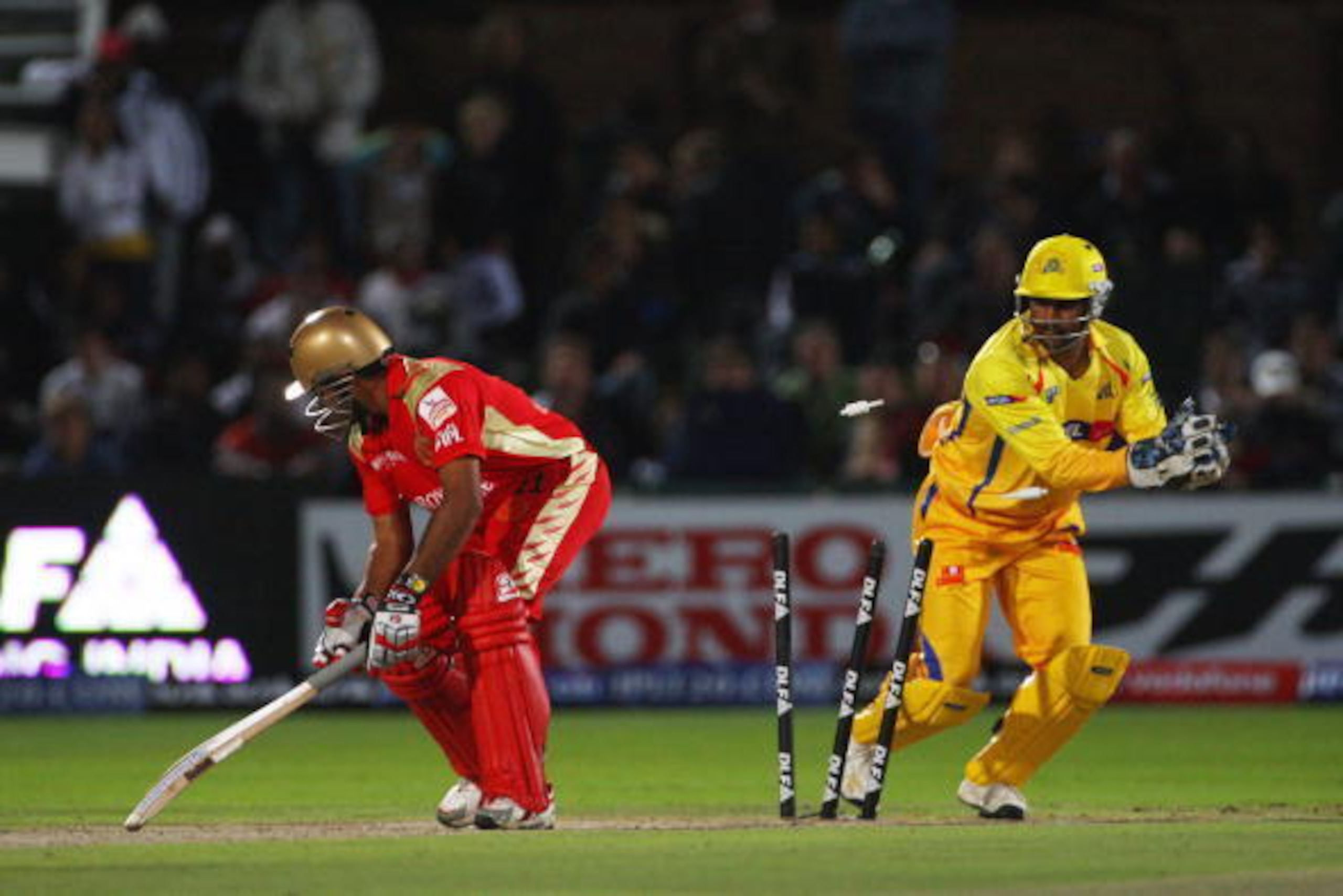 PORT ELIZABETH, SOUTH AFRICA - APRIL 20:  Robin Uthappa of Bangalore is stumped by Mahendra Singh Dhoni of Chennai during IPL T20 match between Chennai Super Kings and Royal Challengers Bangalore at St Georges Cricket Ground on April 20, 2009 in Port Eliz