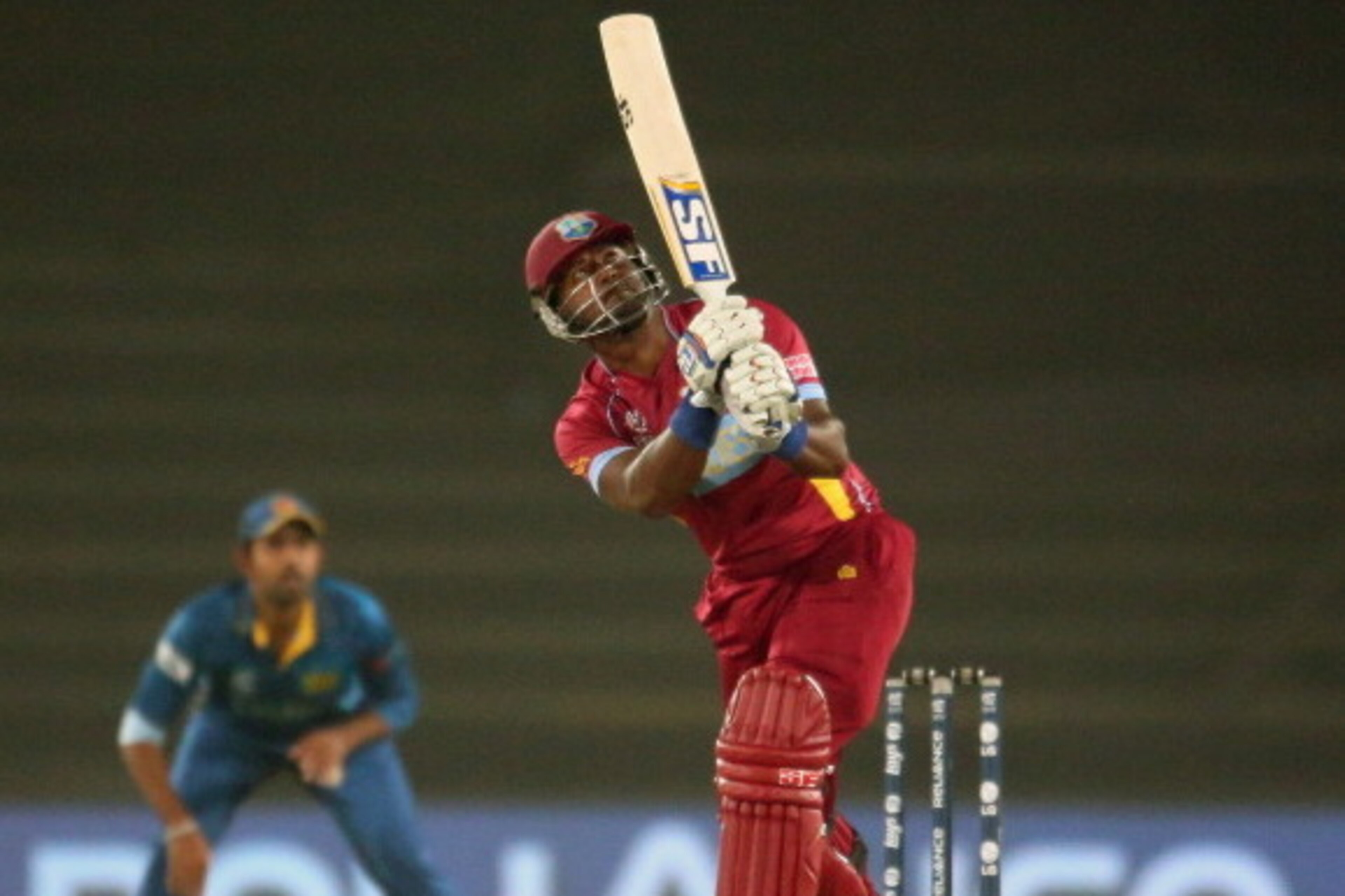 DHAKA, BANGLADESH - APRIL 03:  Dwayne Smith of the West Indies hits a six during the ICC World Twenty20 Bangladesh 2014 1st Semi-Final match between Sri Lanka and the West Indies at Sher-e-Bangla Mirpur Stadium on April 3, 2014 in Dhaka, Bangladesh.  (Pho