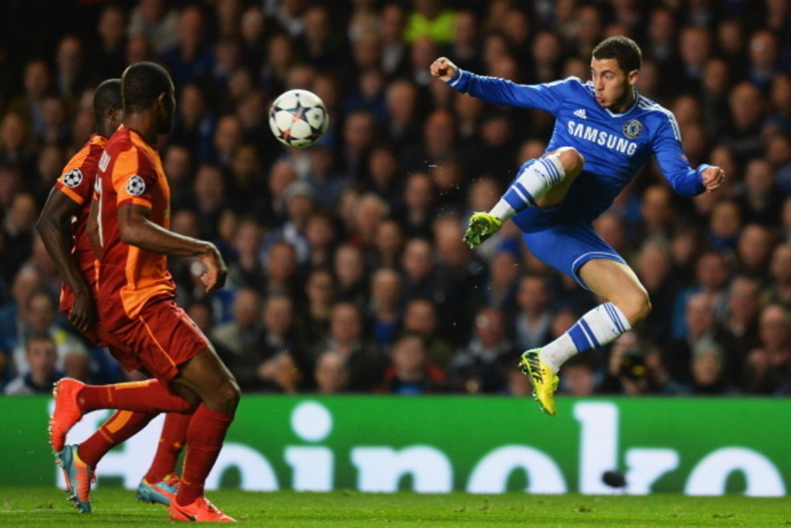 LONDON, ENGLAND - MARCH 18: Eden Hazard of Chelsea jumps for the ball as Emmanuel Eboue (L) and Aurelien Chedjou of Galatasaray look on during the UEFA Champions League Round of 16 second leg match between Chelsea and Galatasaray AS at Stamford Bridge on LONDON, ENGLAND - MARCH 18: Eden Hazard of Chelsea jumps for the ball as Emmanuel Eboue (L) and Aurelien Chedjou of Galatasaray look on during the UEFA Champions League Round of 16 second leg match between Chelsea and Galatasaray AS at Stamford Bridge on